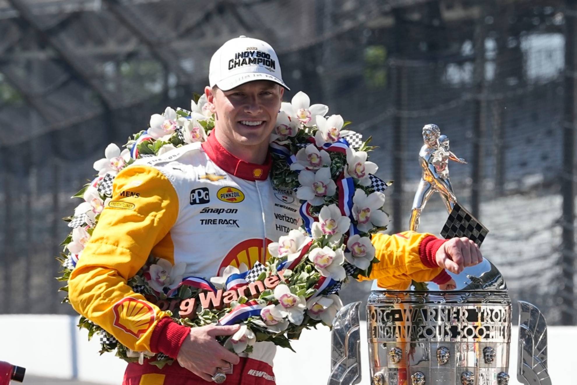 Josef Newgarden poses with the Borg-Warner Trophy during the traditional winners photo session at Indianapolis Motor Speedway