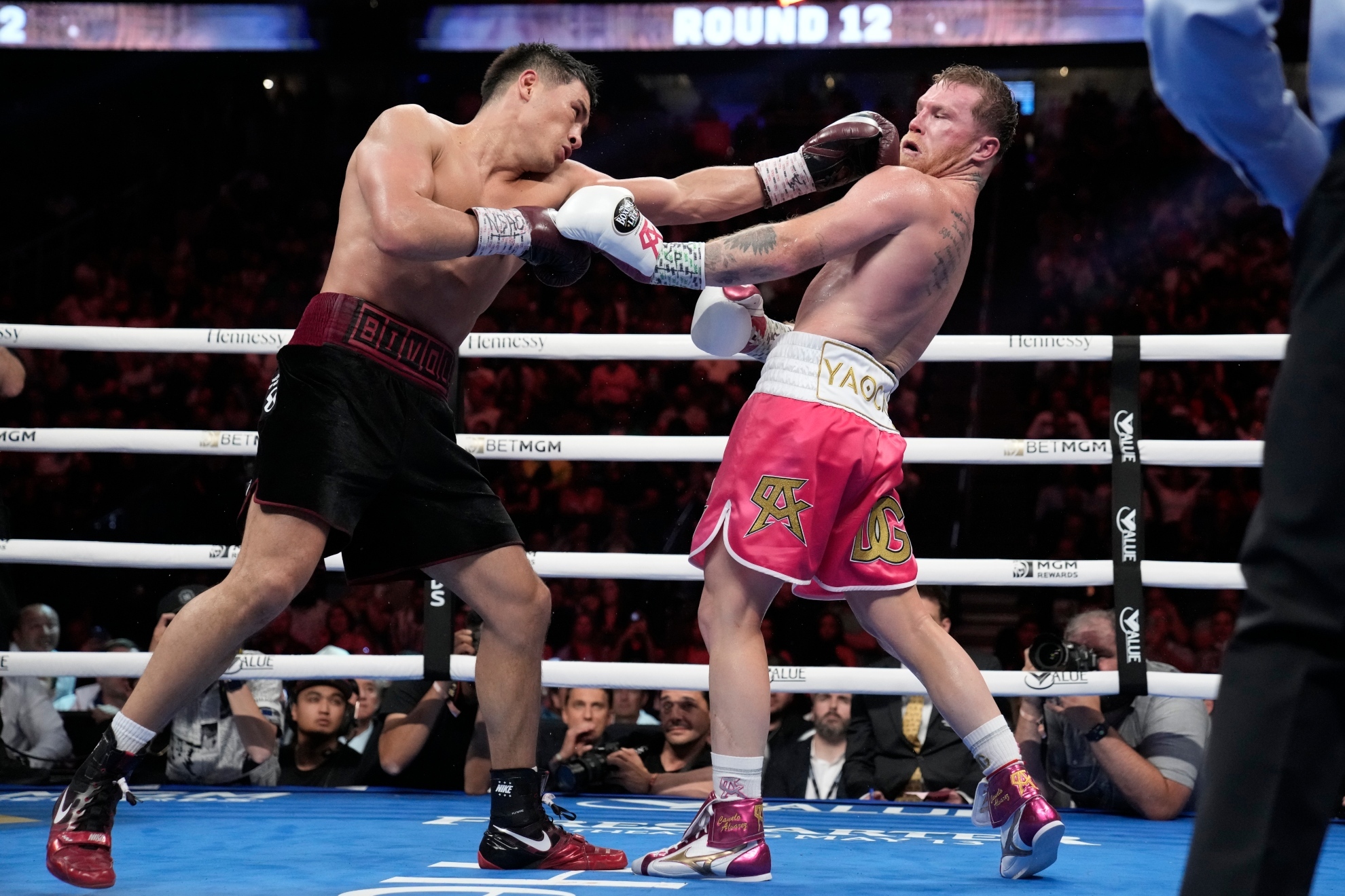 Bivol punching Canelo during their fight.
