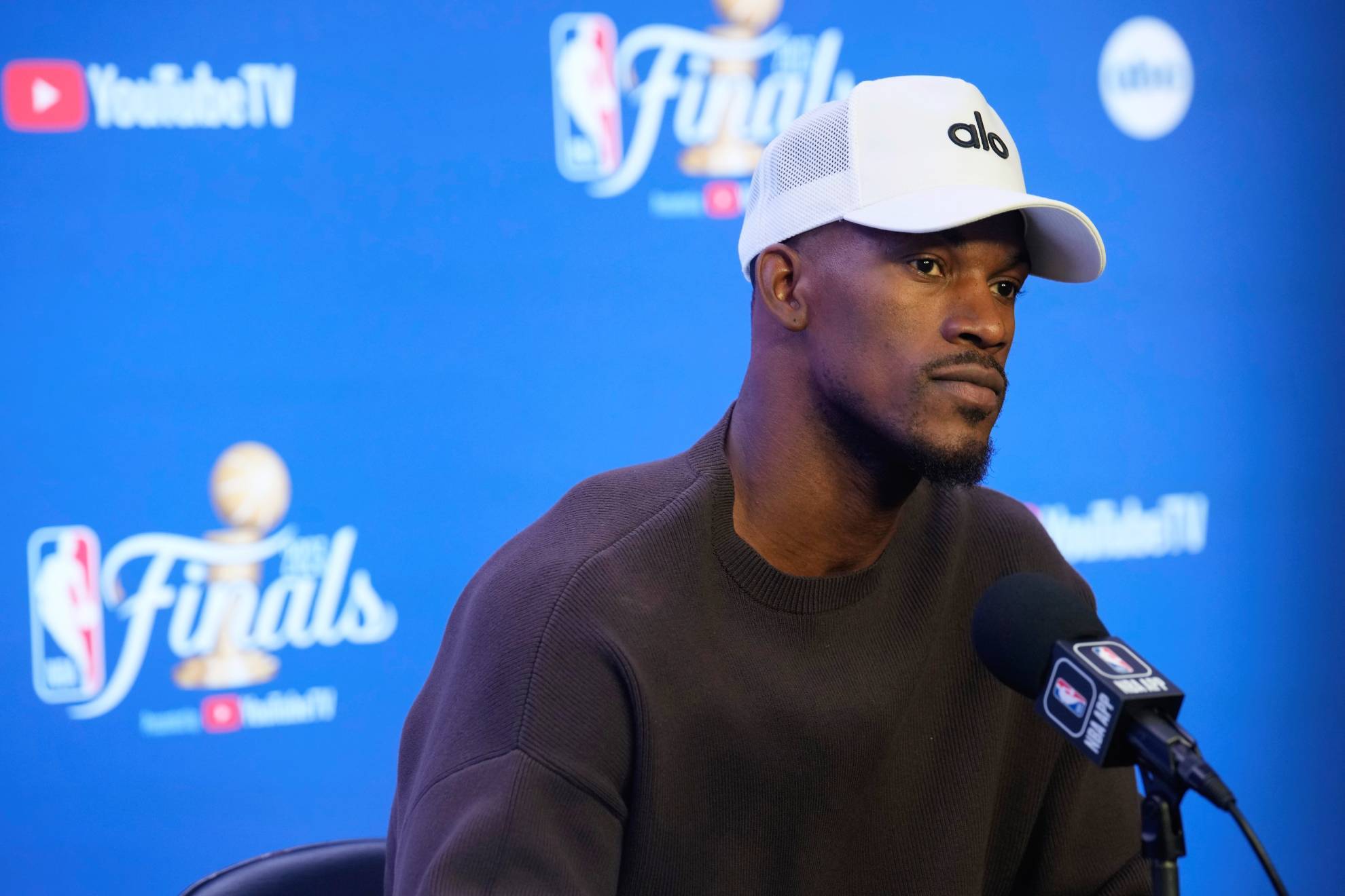 Miami Heat forward Jimmy Butler considers a question at a news conference