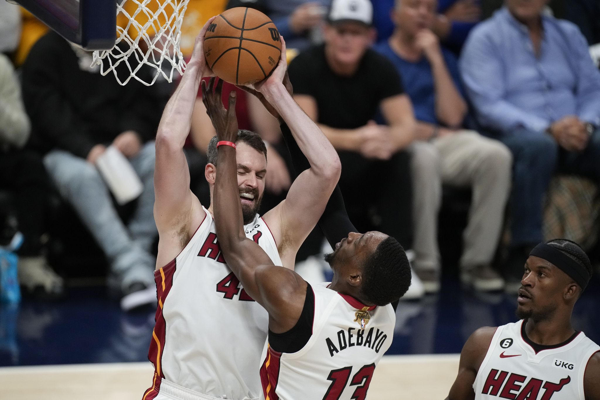 Miami Heat forward  lt;HIT gt;Kevin lt;/HIT gt;  lt;HIT gt;Love lt;/HIT gt;, left, and center Bam Adebayo (13) go up for a rebound against the Denver Nuggets during the second half of Game 2 of basketball's NBA Finals, Sunday, June 4, 2023, in Denver. (AP Photo/David Zalubowski)