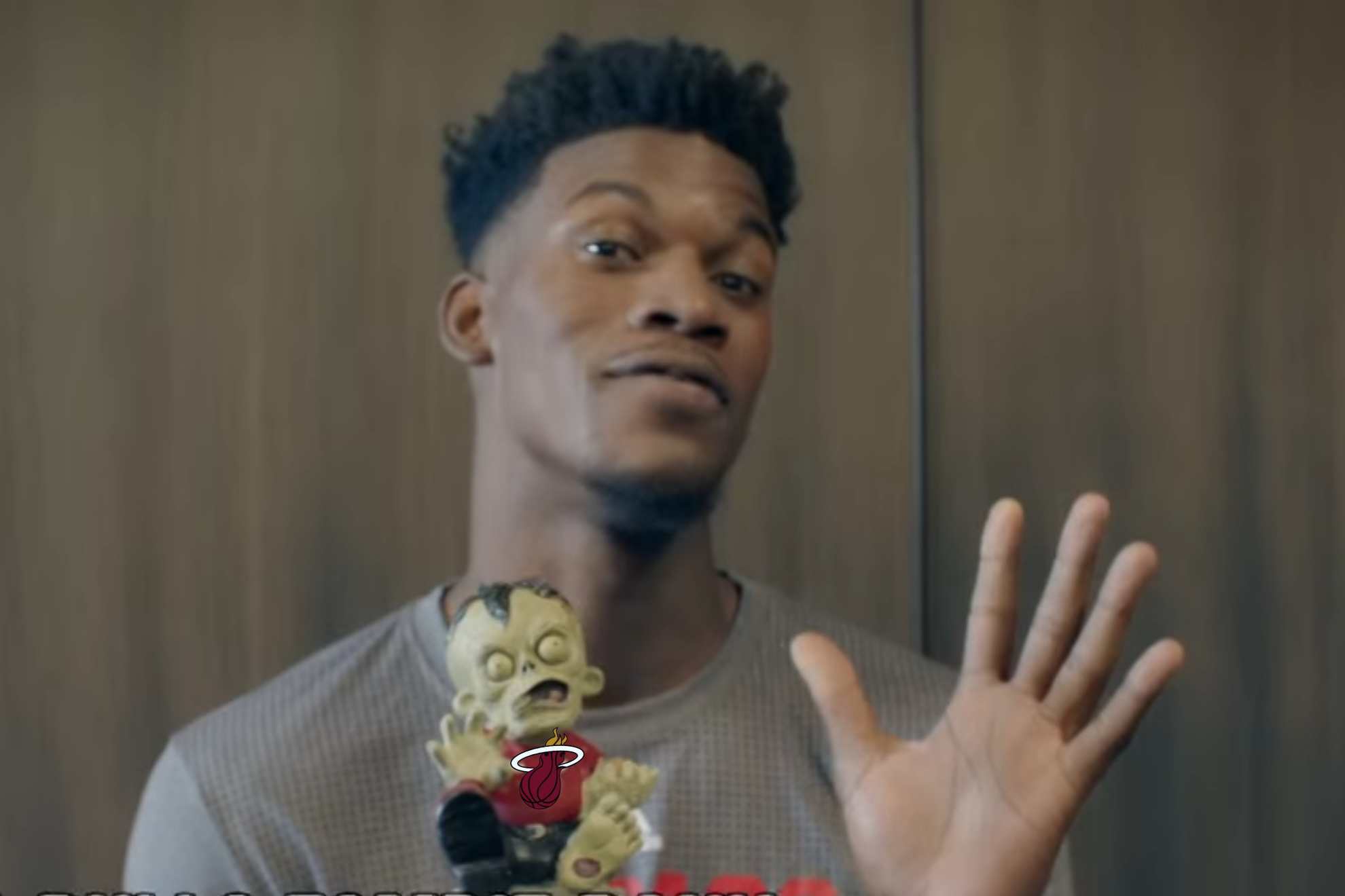 Jimmy Butler poses with a Zombie figurine before his Miami Heat days... was it all a premonition?