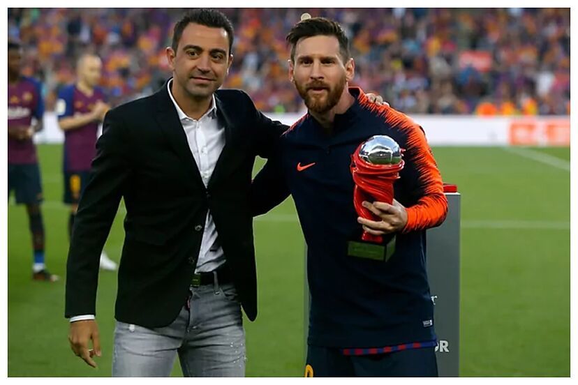 Xavi, con Messi.
