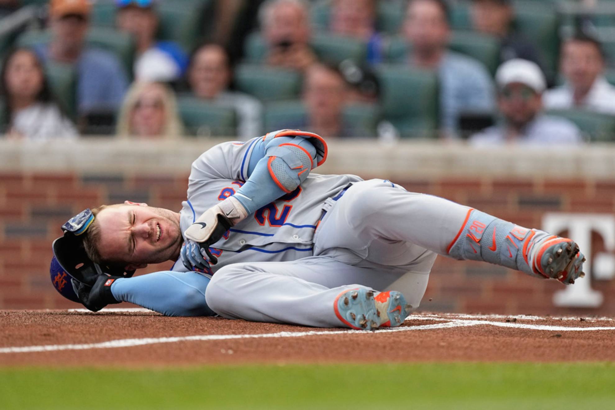Pete Alonso reacts after being hit by a pitch from Atlanta Braves starting pitcher Charlie Morton