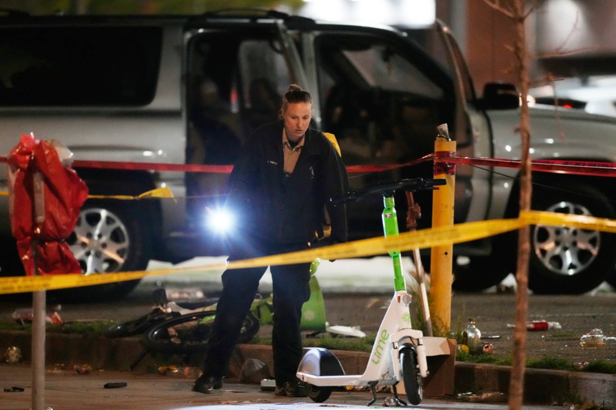 Denver Police Department investigators work the scene of a mass shooting