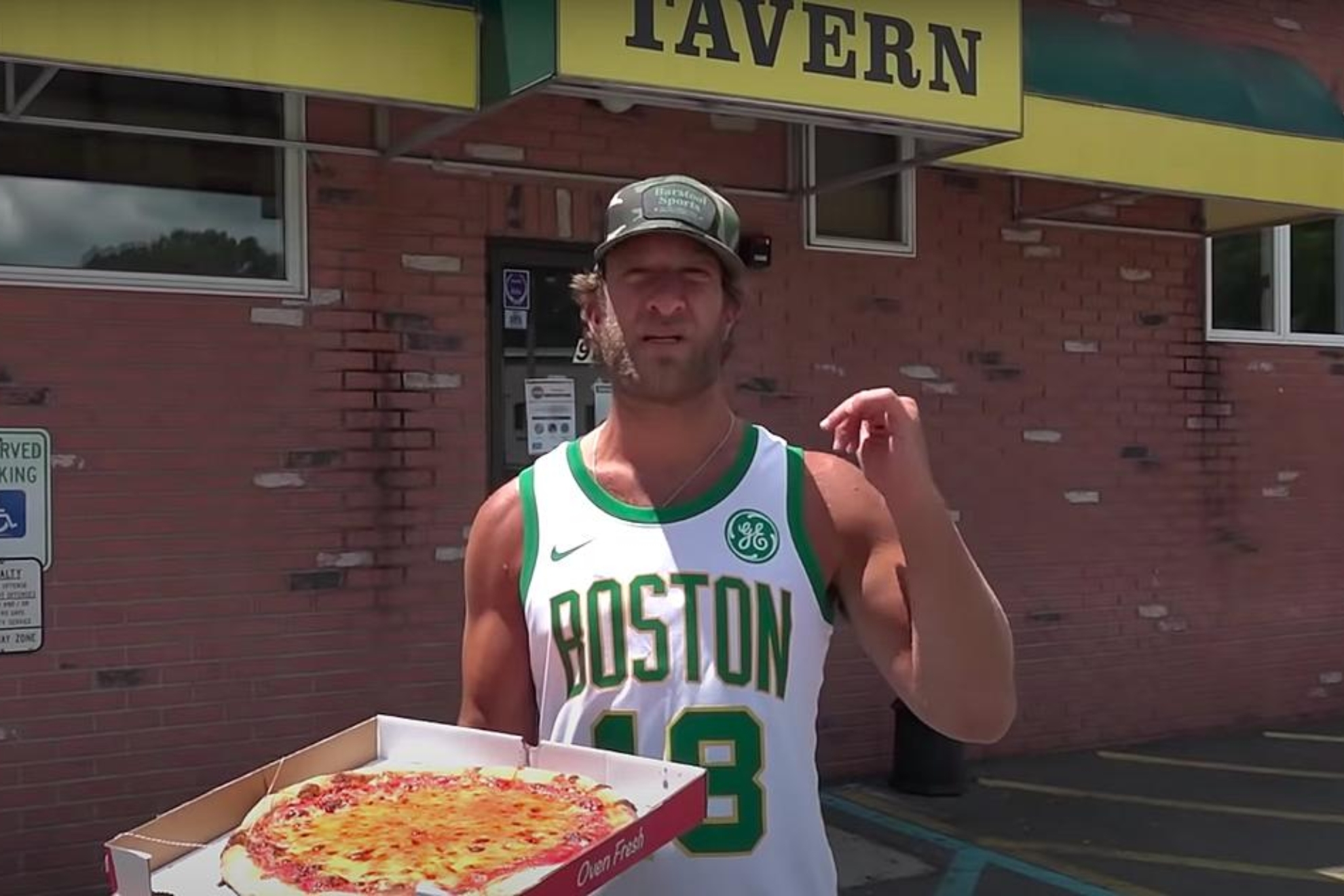 Dave Portnoy revieweing a pizza in Boston.