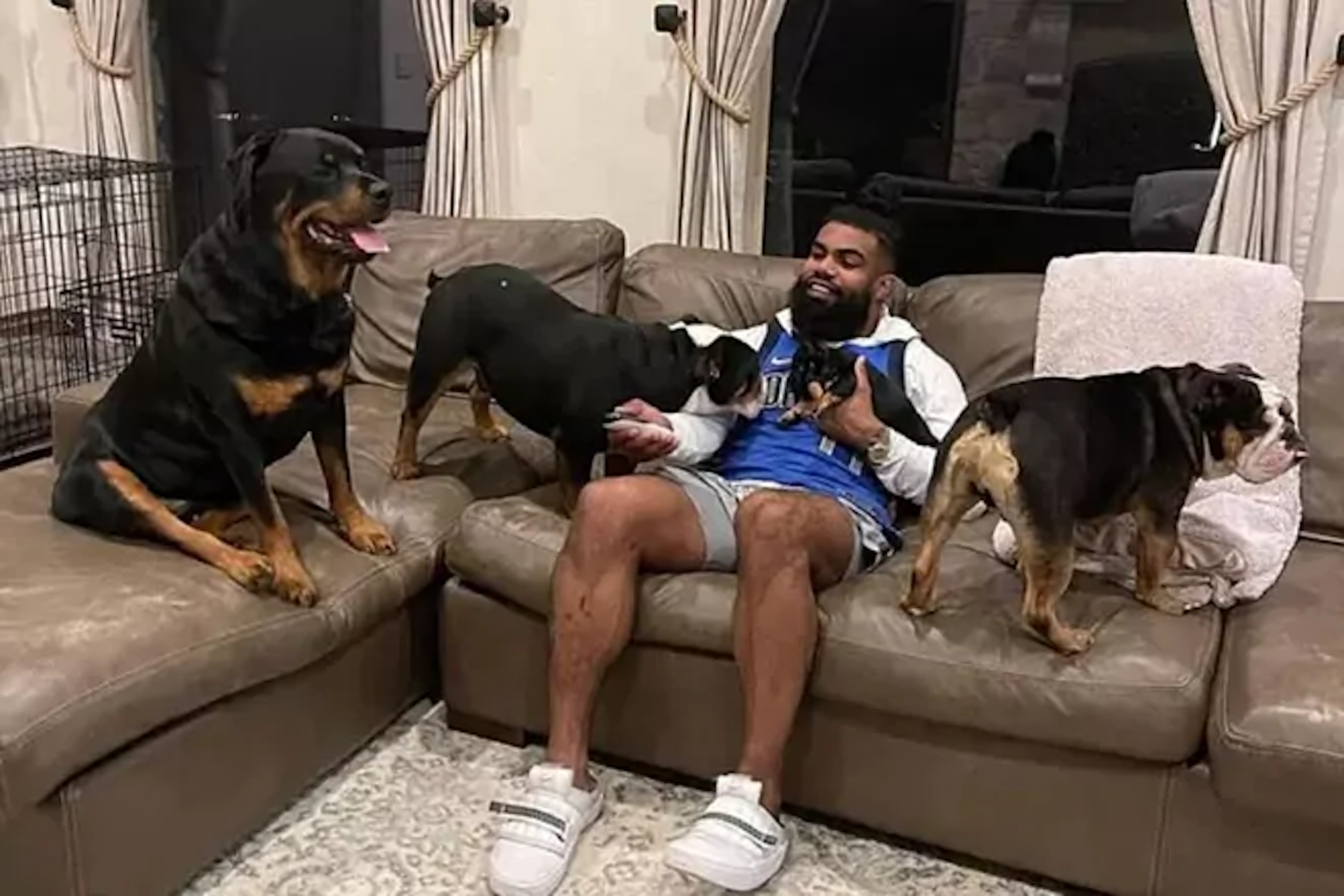 Ezekiel Elliott with his dogs