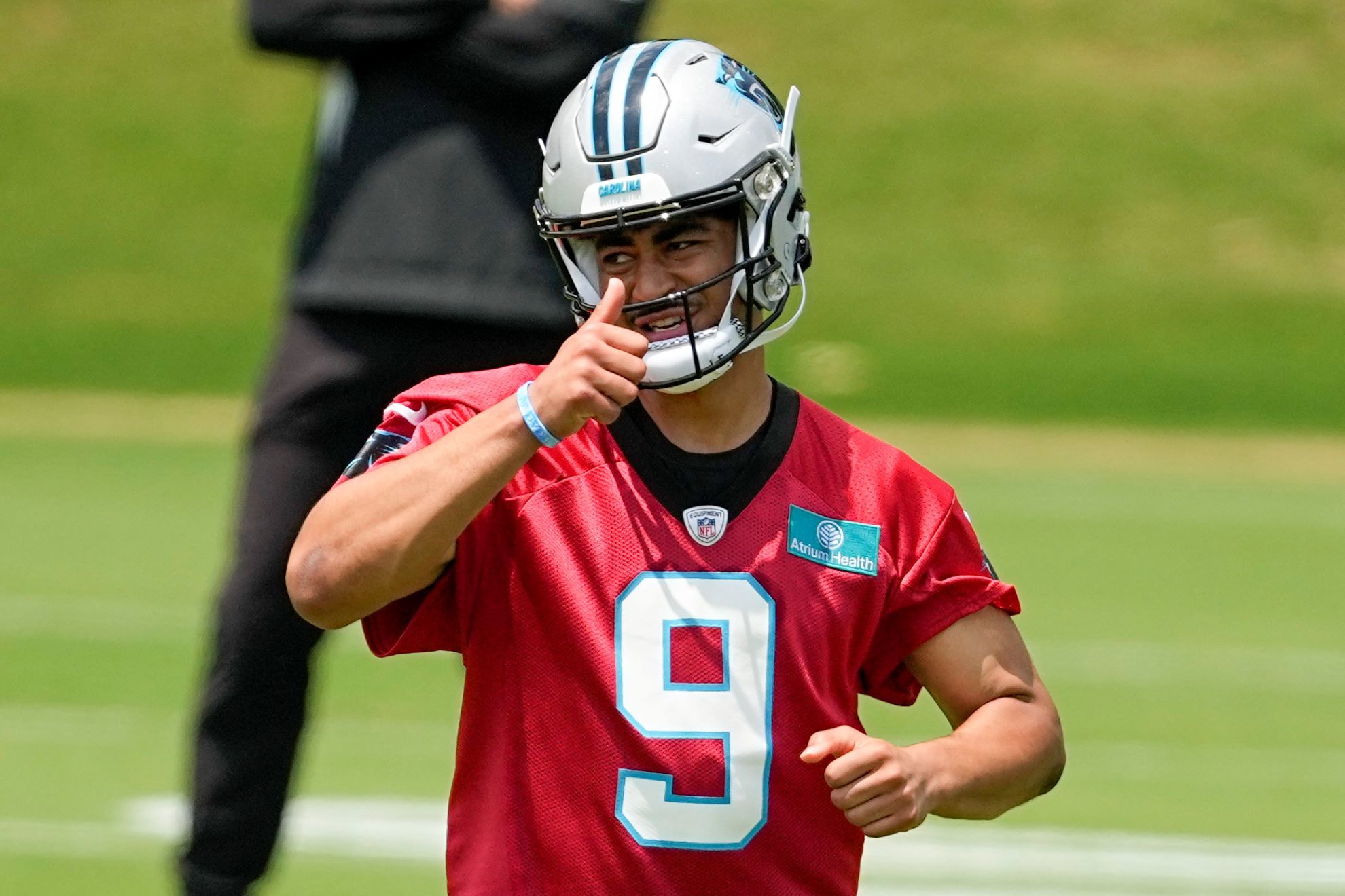 Carolina Panthers quarterback Bryce Young gestures during the NFL football team's rookie minicamp.