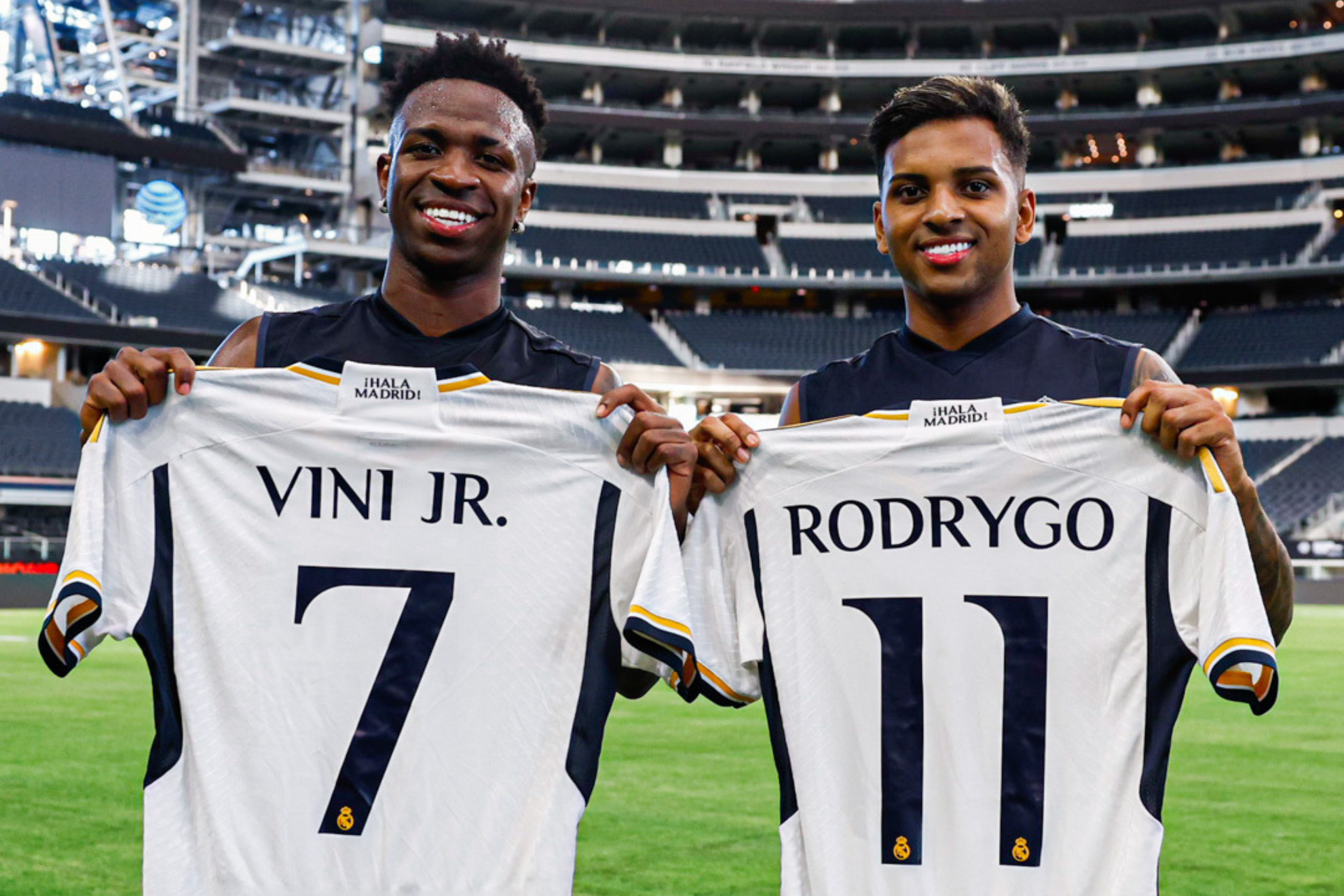 Vinicius Jr. and Rodrygo pose with their new jersey numbers.