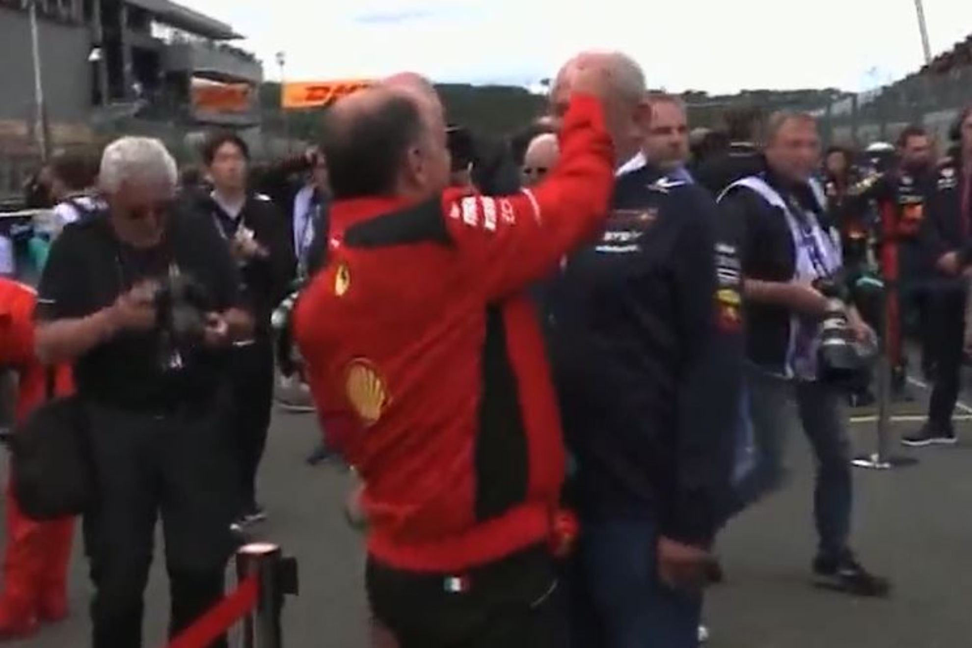 Ferraris Vassuer pastes Red Bull sticker on Helmut Markos forehead