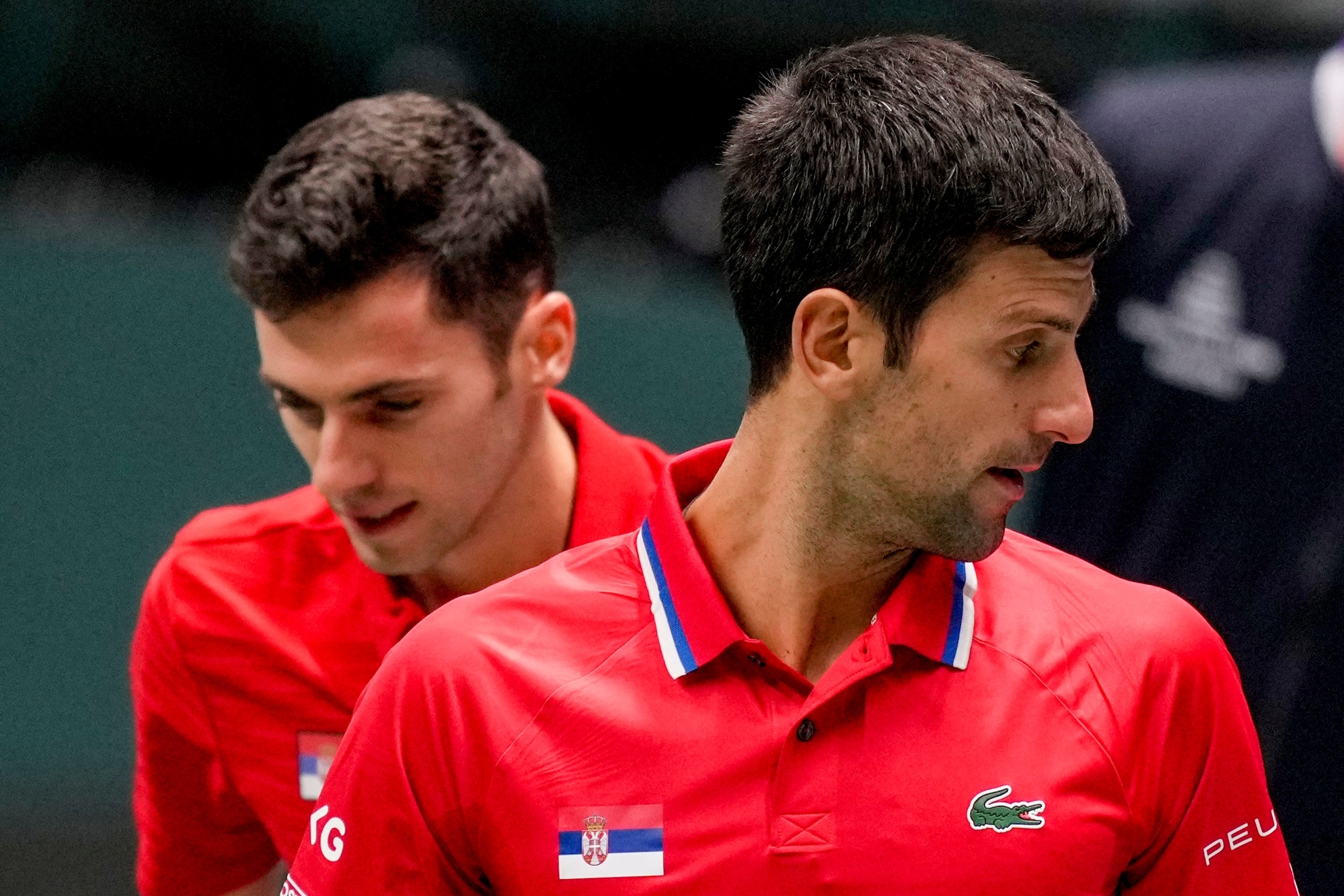 Novak Djokovic y Nikola Cacic durante un partido de la Copa Davis en 2021
