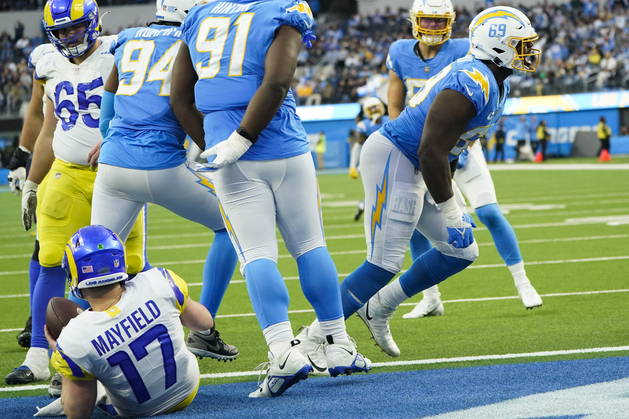 Los Angeles Chargers defensive tackle Sebastian Joseph-Day as he celebrates his sack against Los Angeles Rams quarterback.