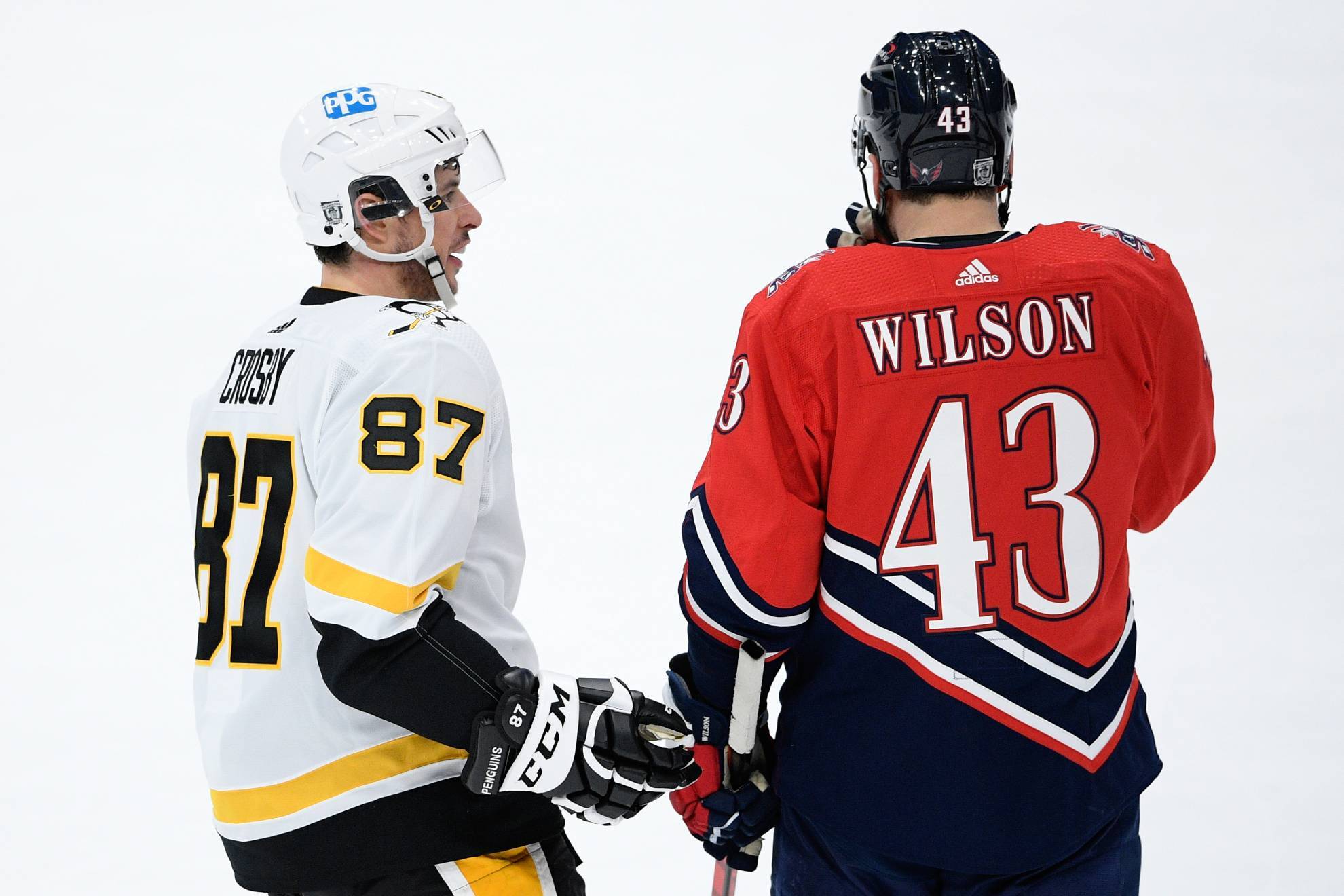 Pittsburgh Penguins center Sidney Crosby talks with Washington Capitals right wing Tom Wilson