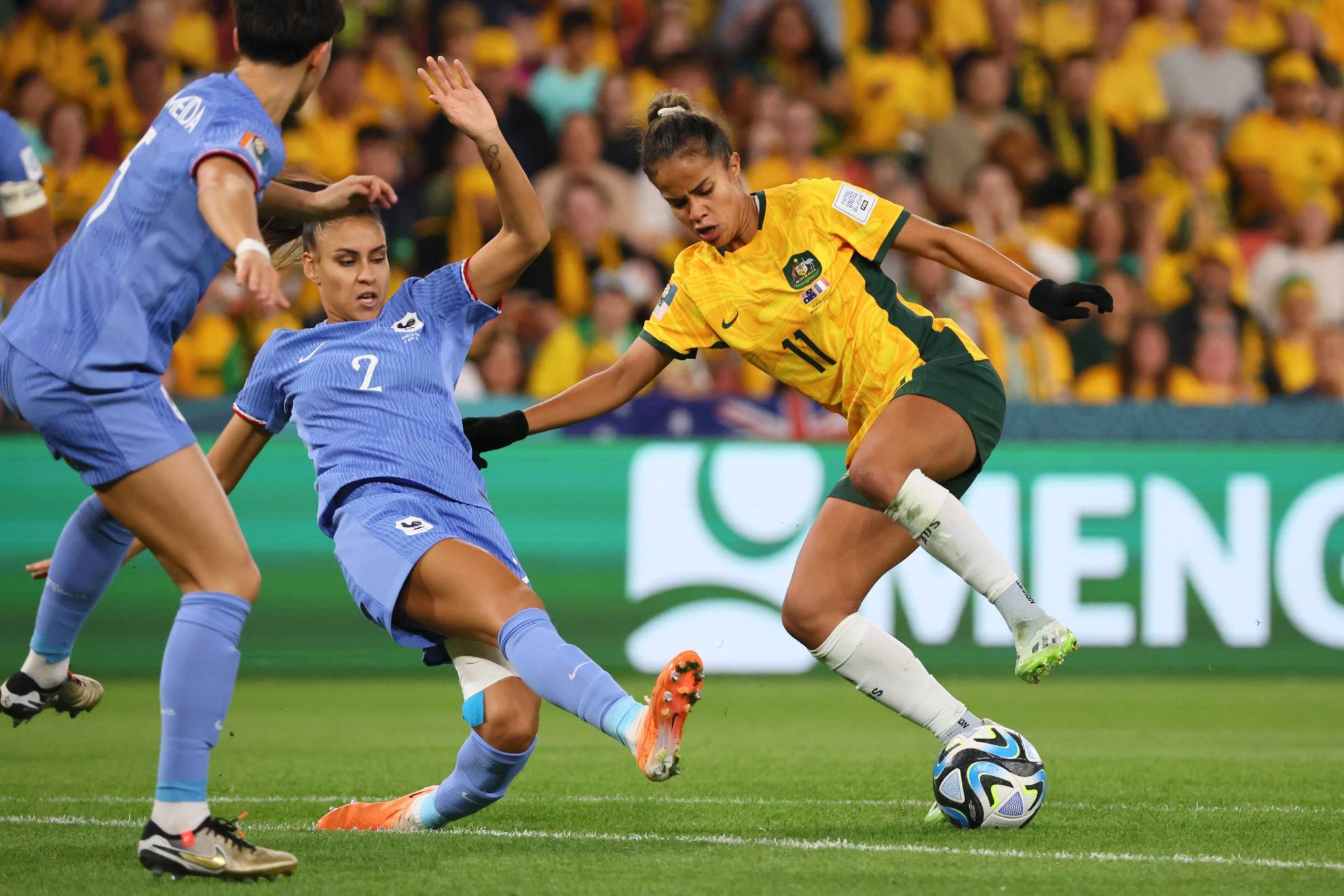 Australia's Mary Fowler, right, challenges for the ball with France's Maelle Lakrar