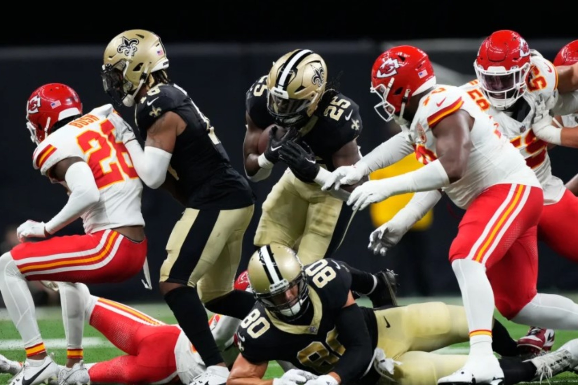 Kendre Miller of the New Orleans Saints runs the ball in preseason Week 1 against the Chiefs