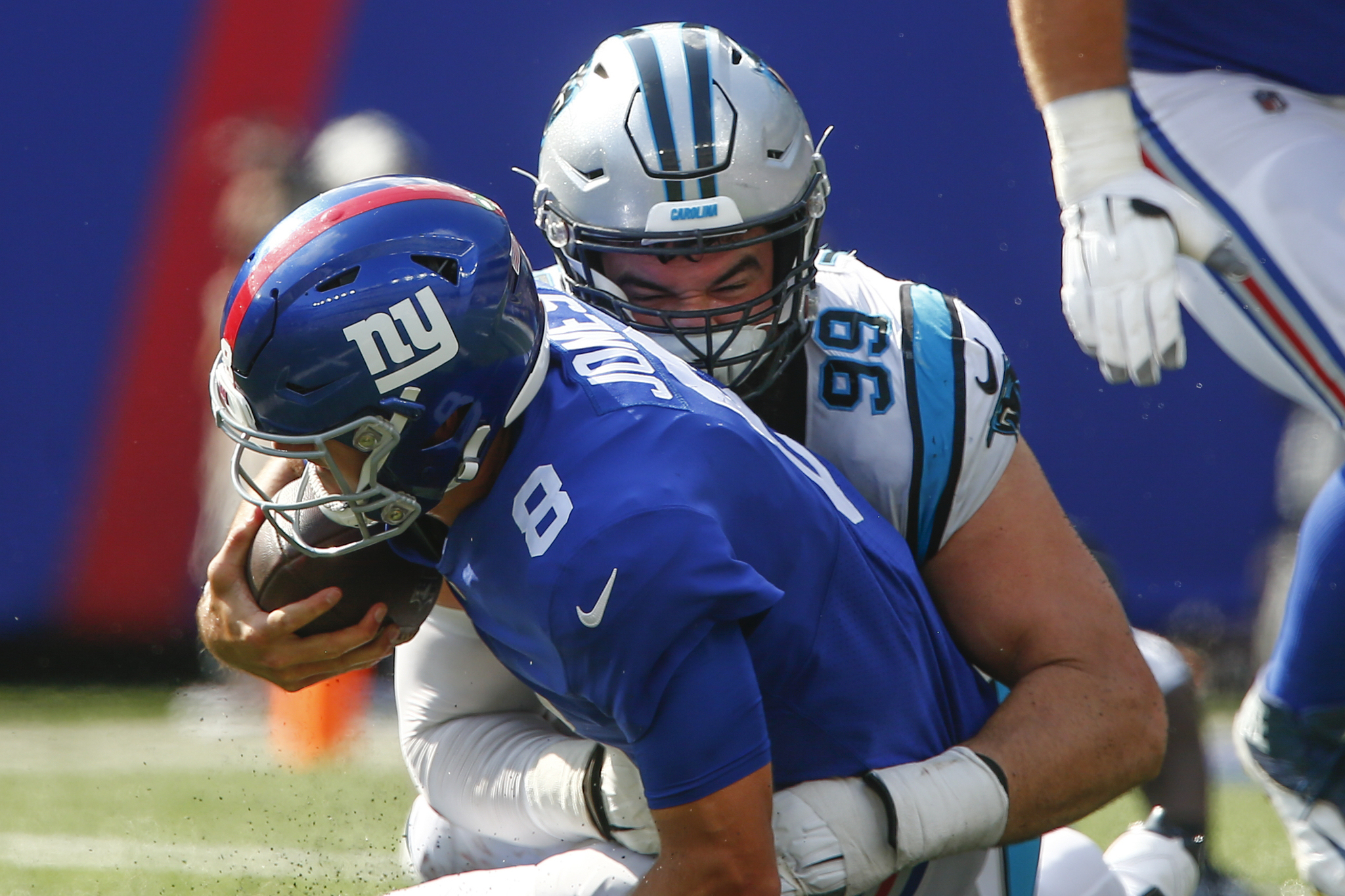 Carolina Panthers' Matt Ioannidis sacks New York Giants quarterback Daniel Jones during their last game.