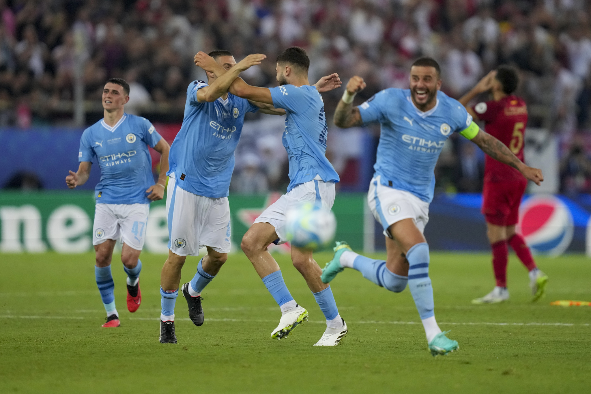 Manchester City players celebrate winning the Super Cup