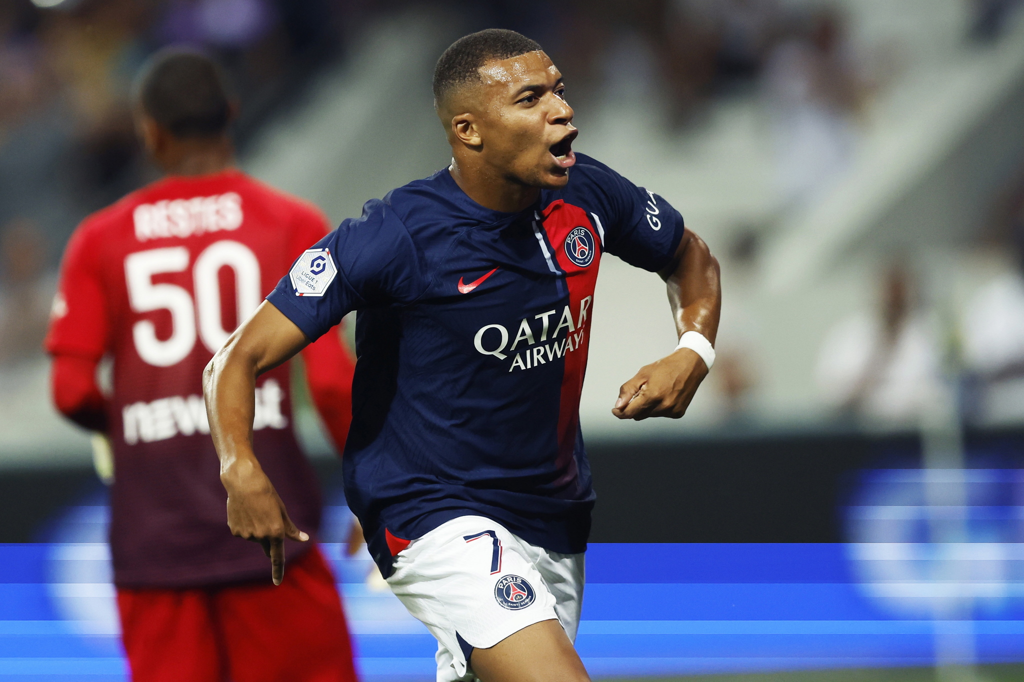Paris Saint Germain's Kylian Mbappe celebrates after scoring a penalty