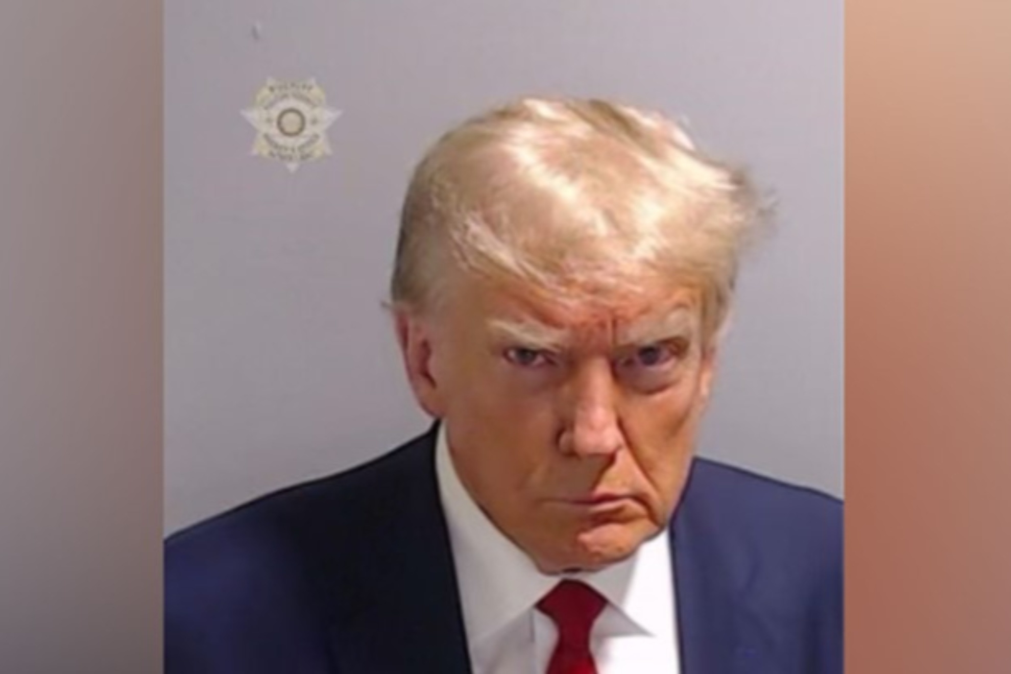 Donald Trump has been booked on 13 felony charges at an Atlanta jail