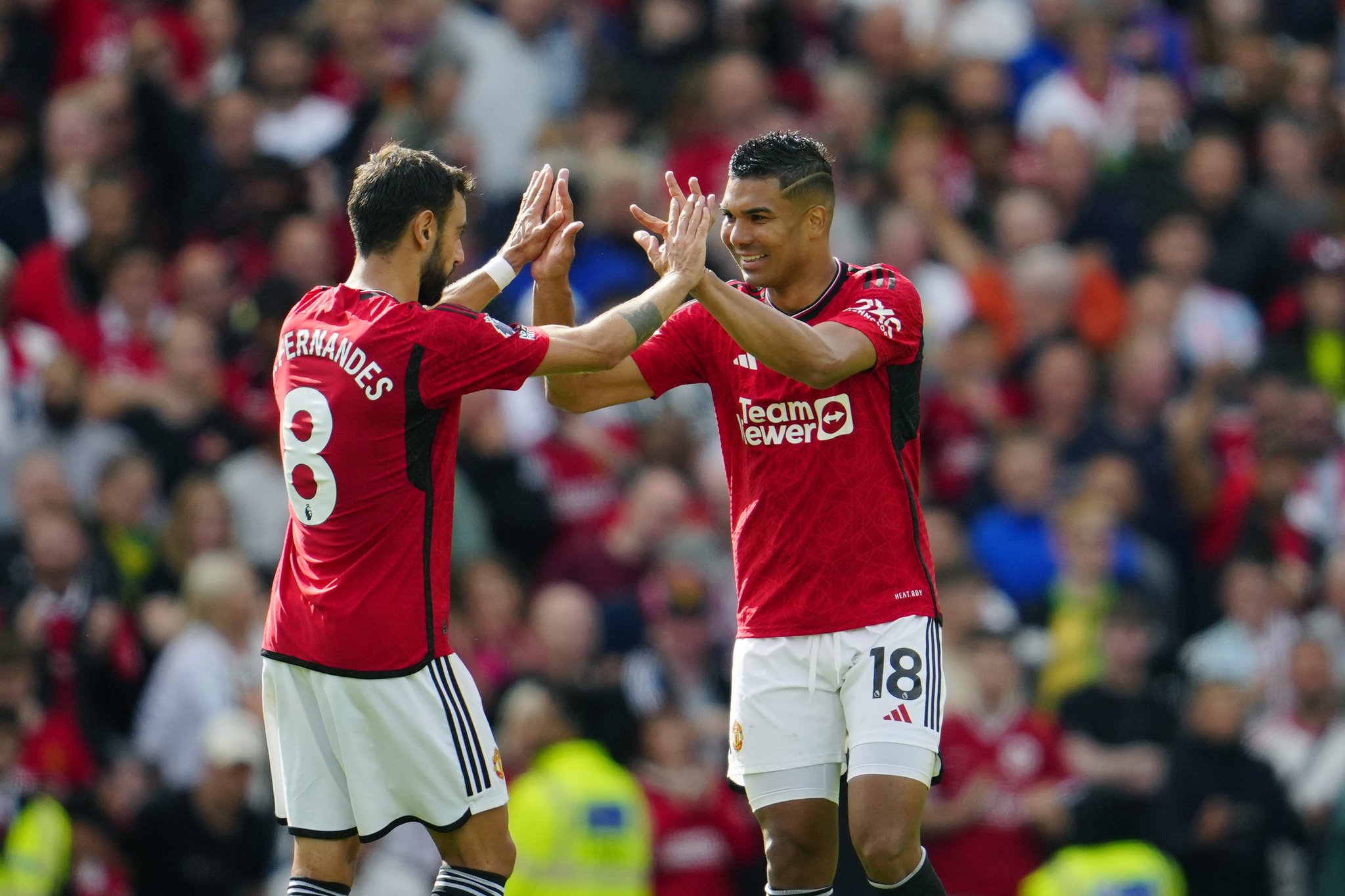 Manchester United's Casemiro, right, celebrates with Bruno Fernandes