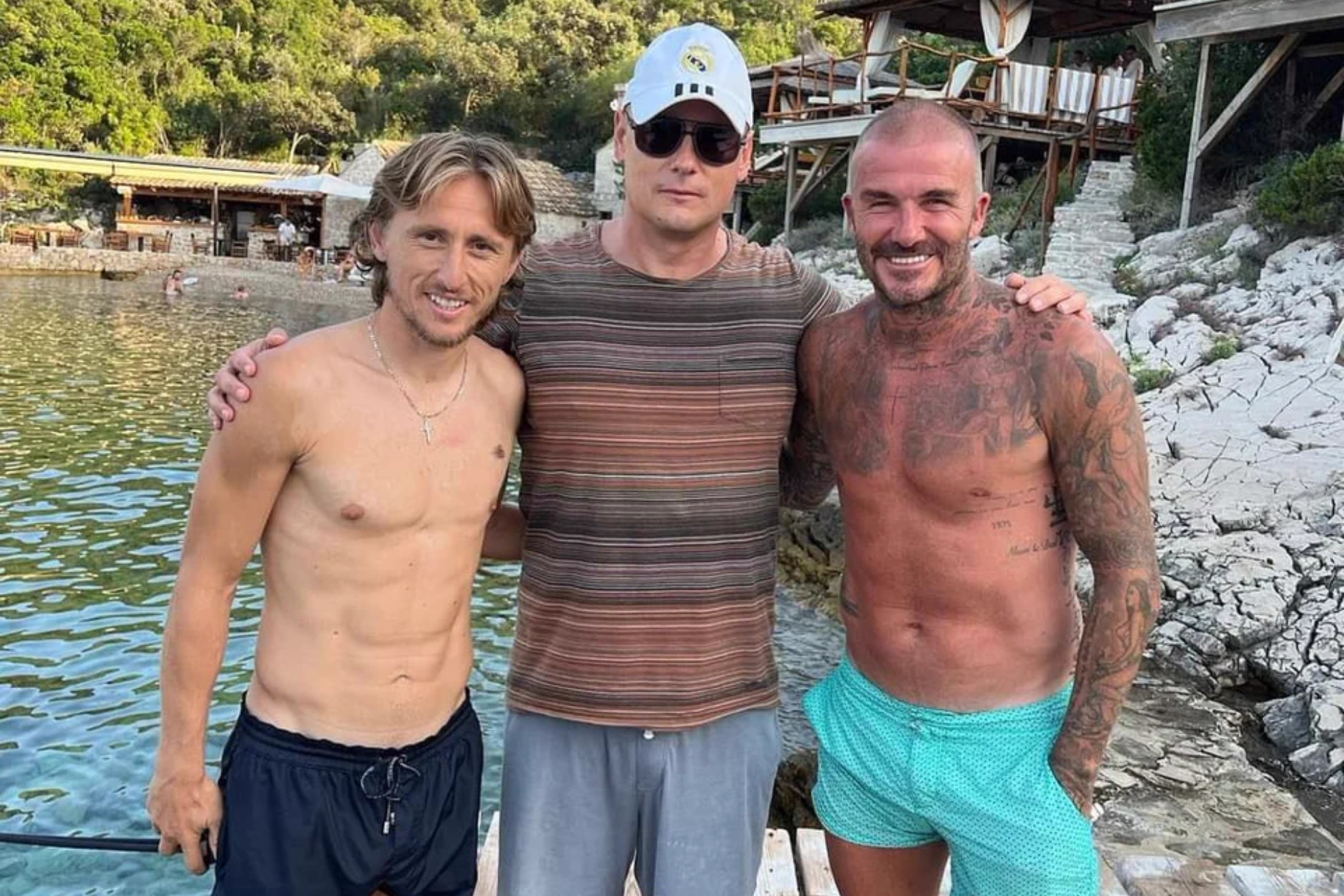 Luka Modric and David Beckham pose for a picture in Croatia with a fan.