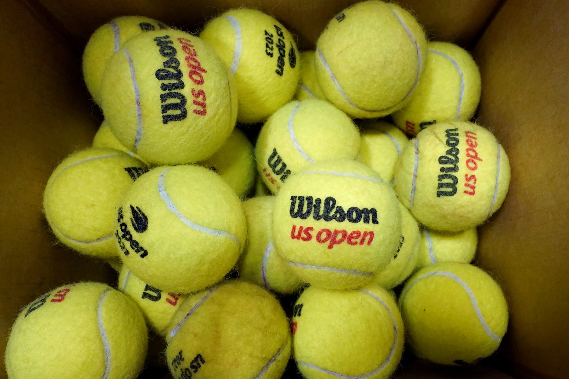 A box of game-used tennis balls rest in a shipping box during the U.S. Open tennis championships
