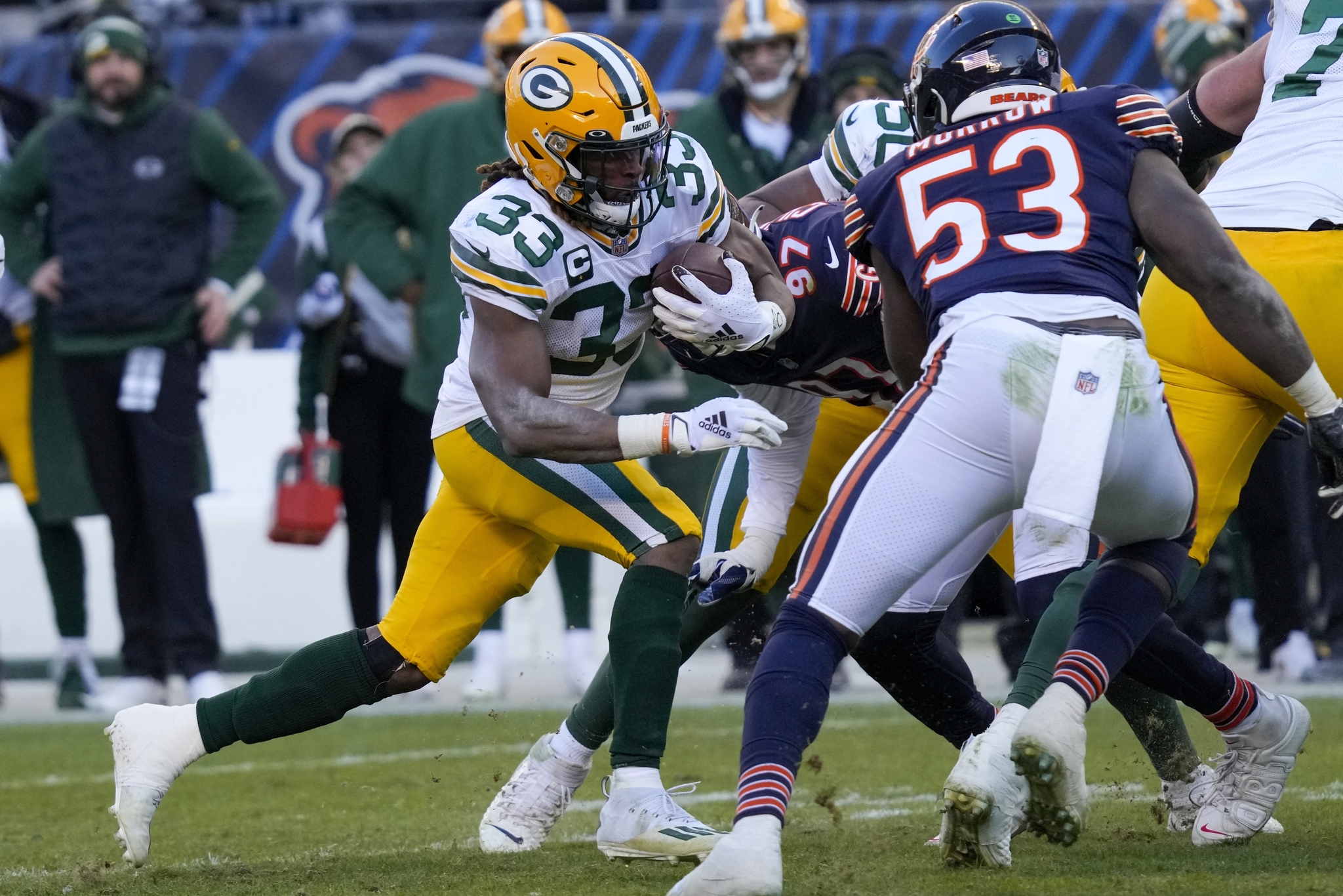 Green Bay Packers AJ Dillon runs for a touchdown past DeAndre Houston-Carson.