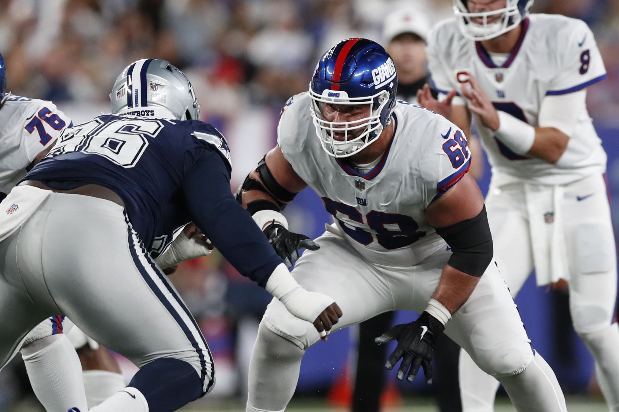 New York Giants guard Ben Bredeson moves in to block Dallas Cowboys defensive tackle Neville Gallimore.