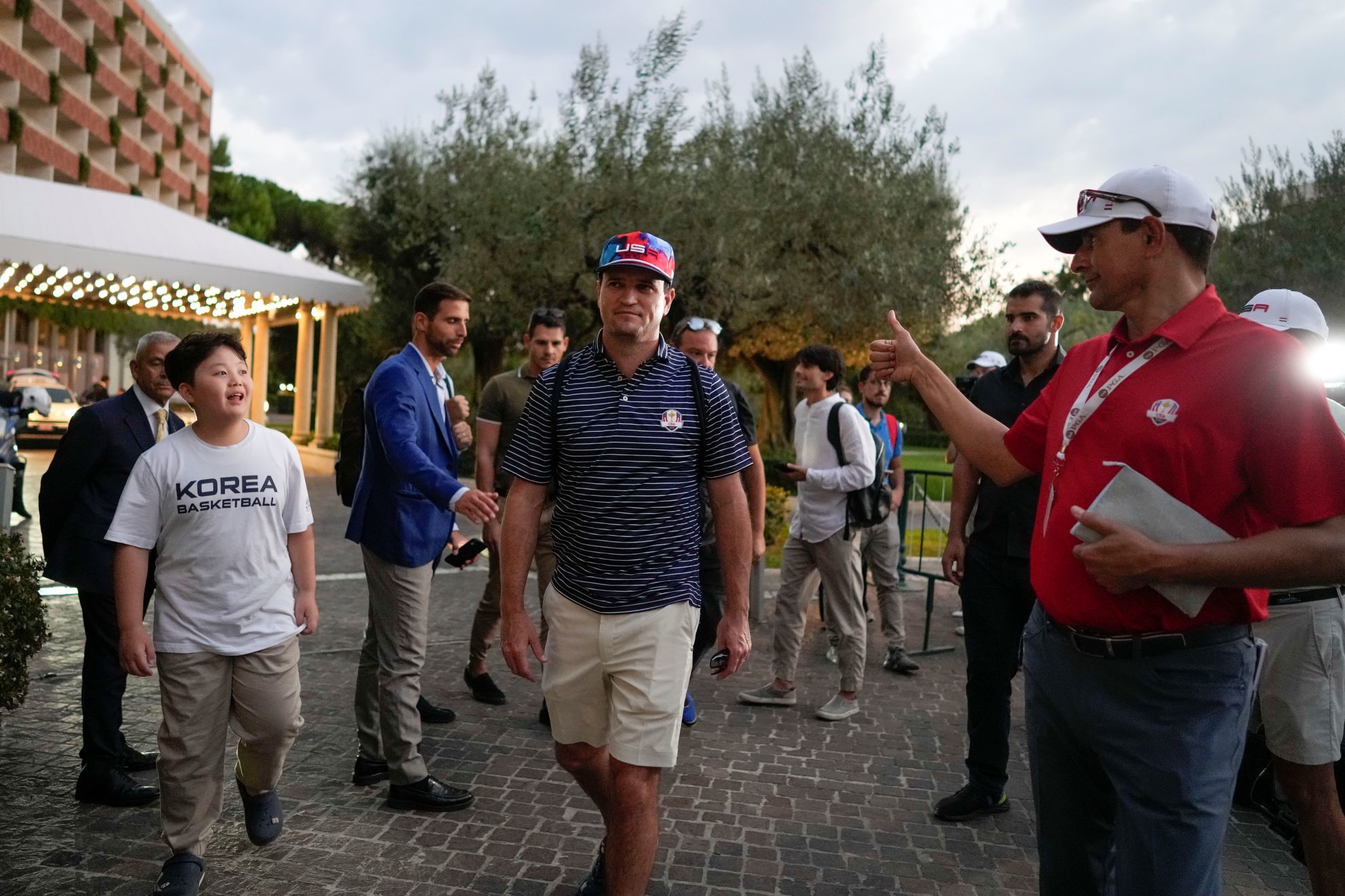 USA Ryder Cup team captain Zach Johnson returns with members of his team at a hotel in Rome