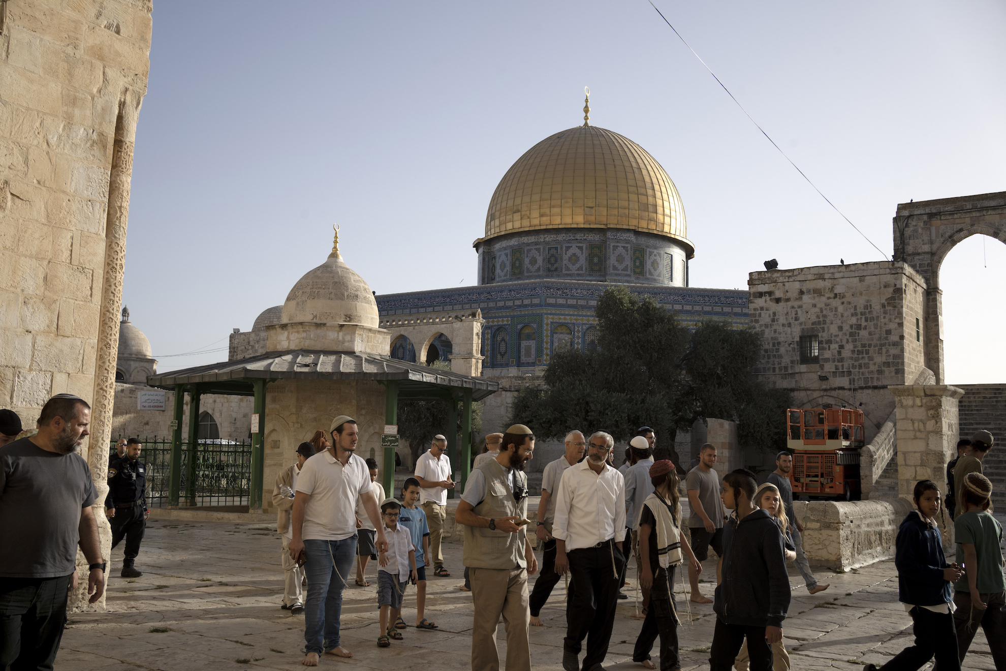 Jews visit the Temple Mount, known to Muslims as the Noble Sanctuary, on the Al-Aqsa Mosque compound in the Old City of Jerusalem, on the morning before Rosh Hashana, the Jewish New Year, which begins at sundown, Sunday, Sept. 25, 2022.