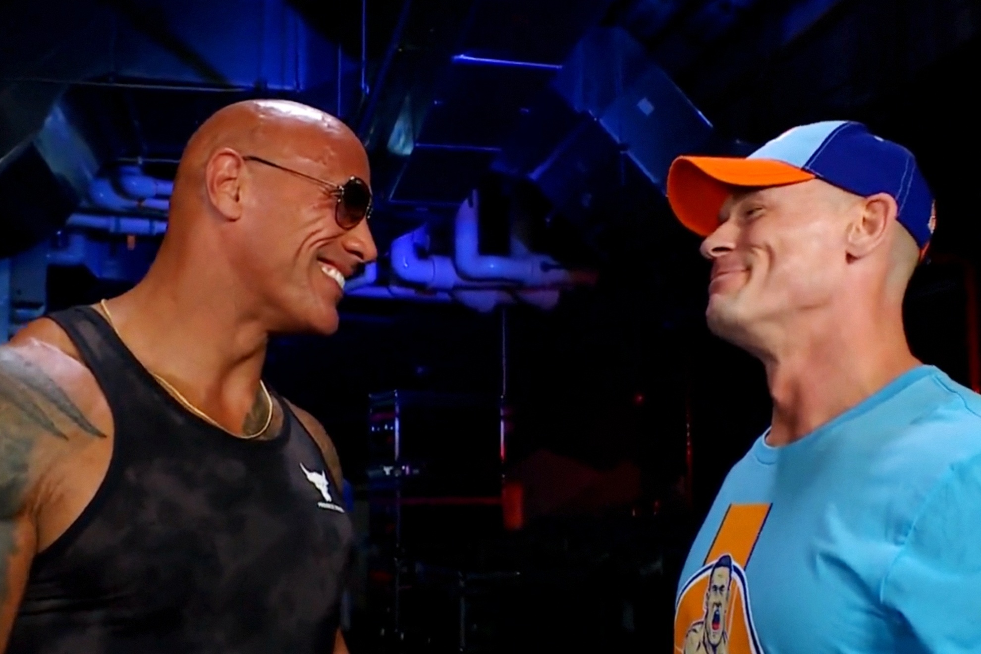 The Rock and John Cena embrace on WWE SmackDown.