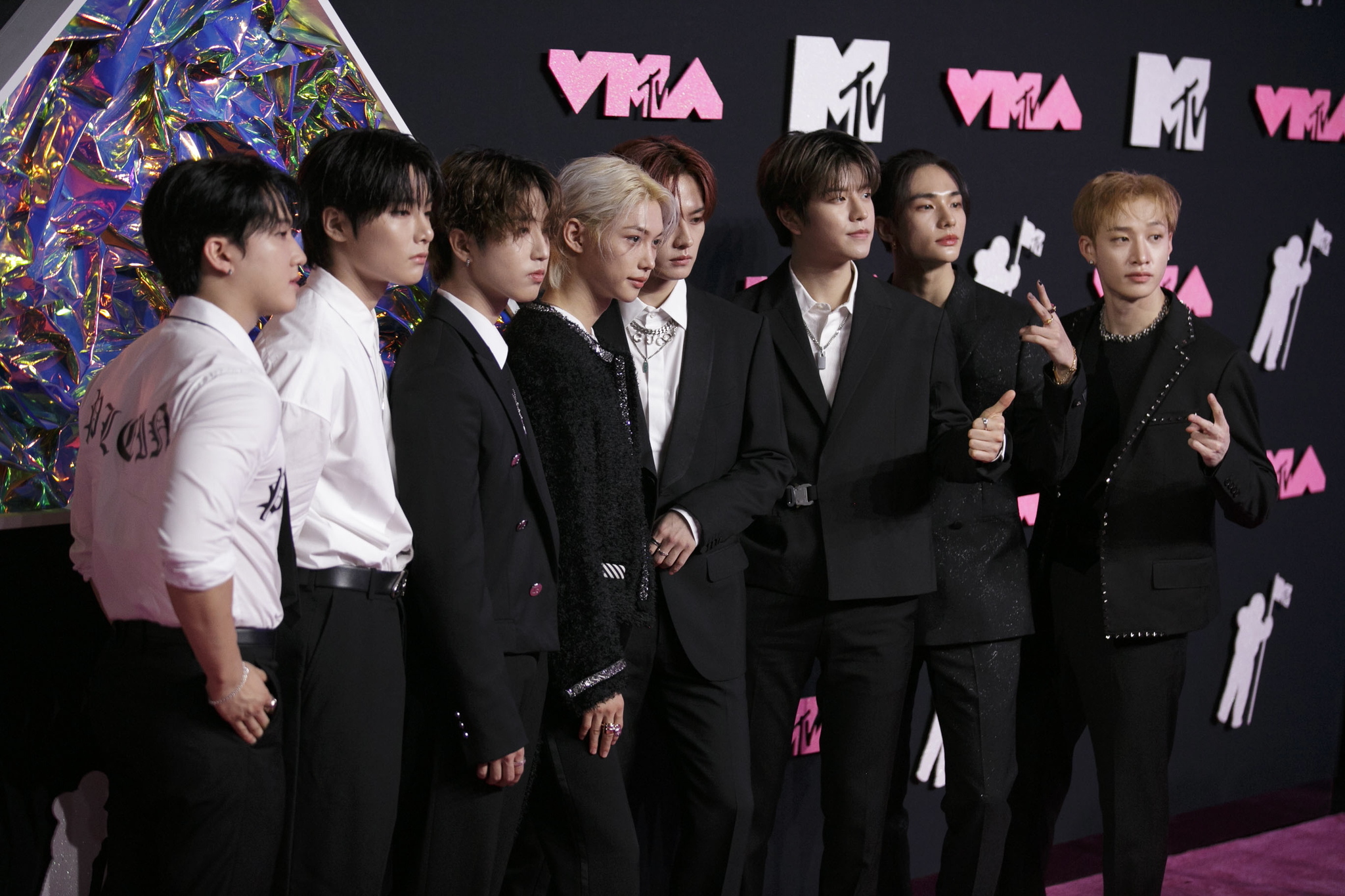 South Korean boy group Stray Kids pose on the red carpet during the MTV Video Music Awards