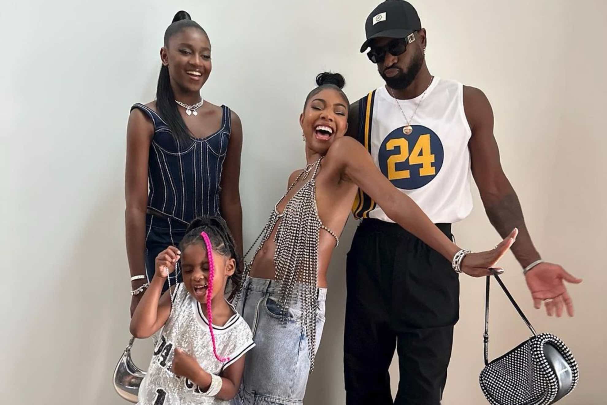 Dwyane Wade with Gabrielle Union and his daughters Zaya and Kaavia