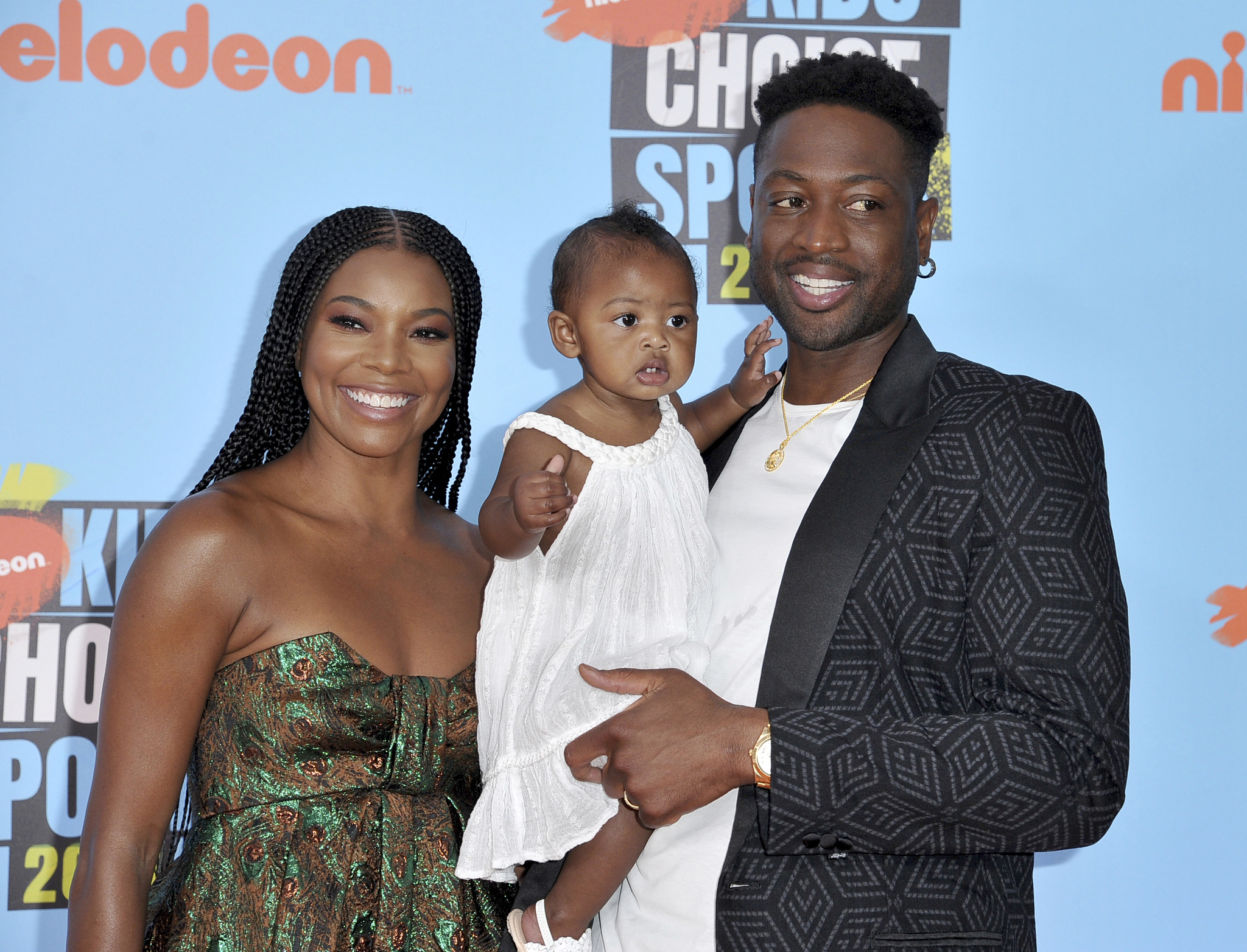 Gabrielle Union, left, Dwyane Wade, right, and their daughter Kaavia James Union Wade
