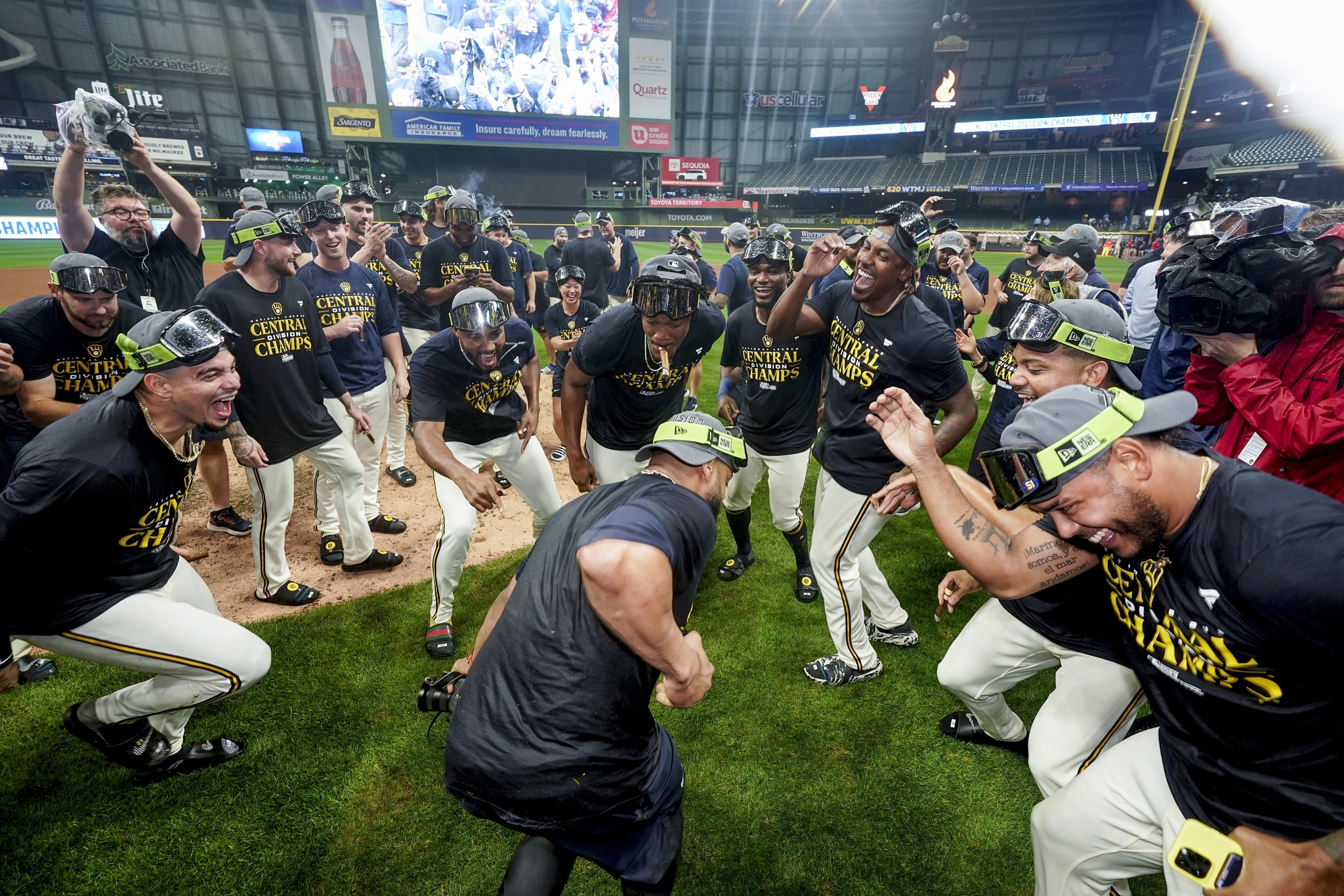 Milwaukee Brewers players celebrate after clinching the National League Central Division.