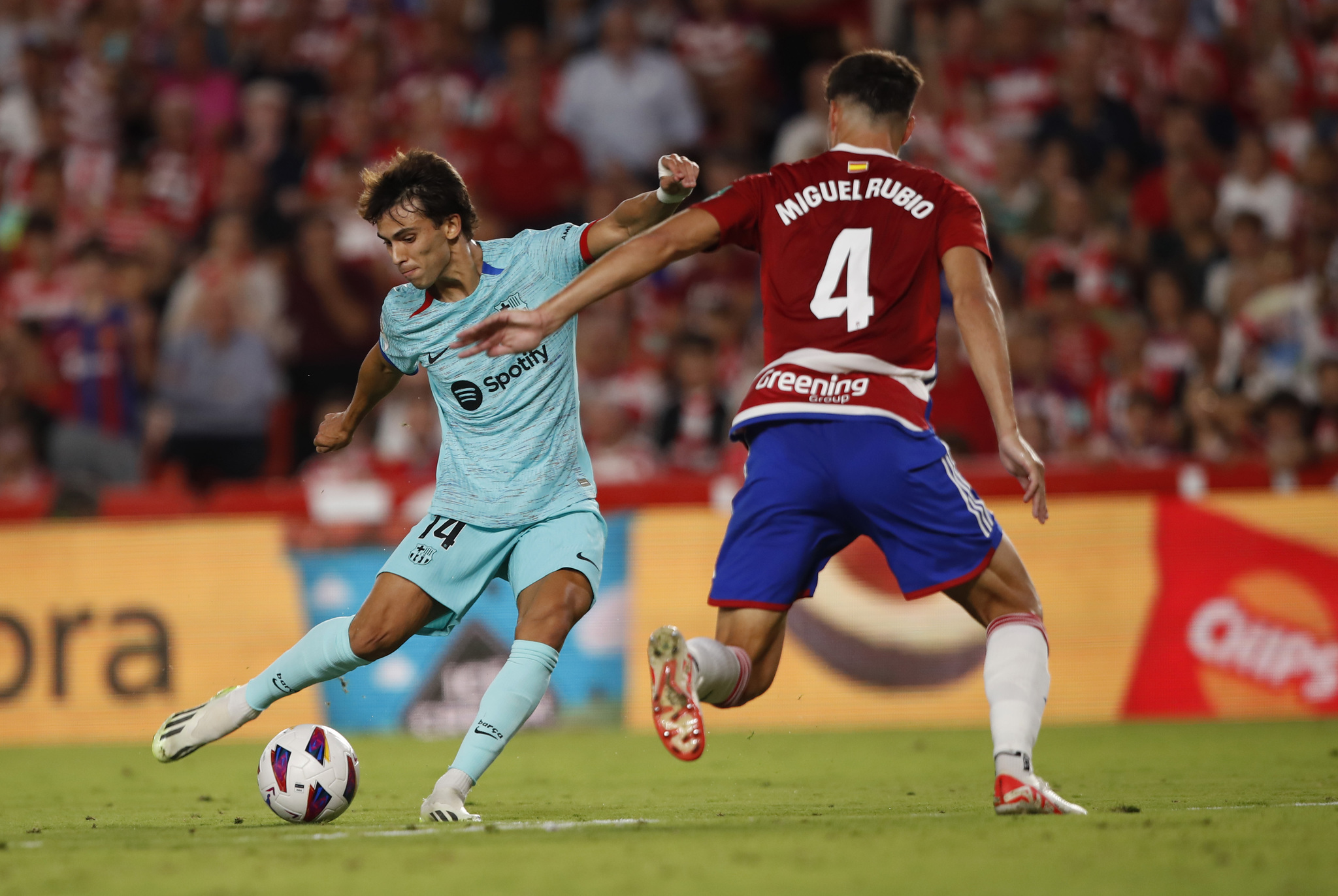 Barcelona's Joao Felix fights for the ball with  lt;HIT gt;Granada lt;/HIT gt;'s Miguel Rubio during a Spanish La Liga soccer match between  lt;HIT gt;Granada lt;/HIT gt; and Barcelona at Los Carmanes Stadium in  lt;HIT gt;Granada lt;/HIT gt;, Spain, Sunday, Oct. 8, 2023. (AP Photo/Fermin Rodriguez)