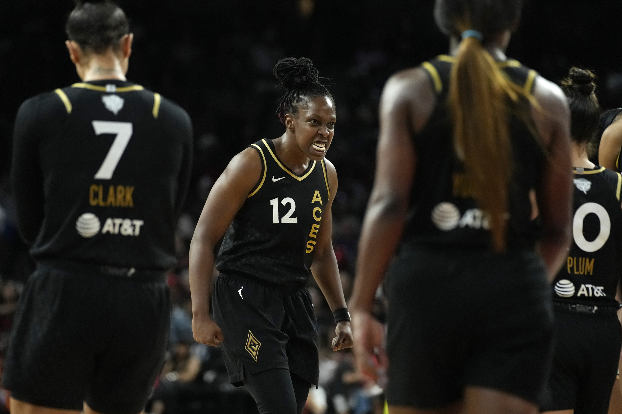 Las Vegas Aces guard Chelsea Gray (12) celebrates after a play against the New York Liberty during the second half in Game 1 of a WNBA basketball final playoff series Sunday, Oct. 8, 2023, in Las Vegas. (AP Photo/John Locher)