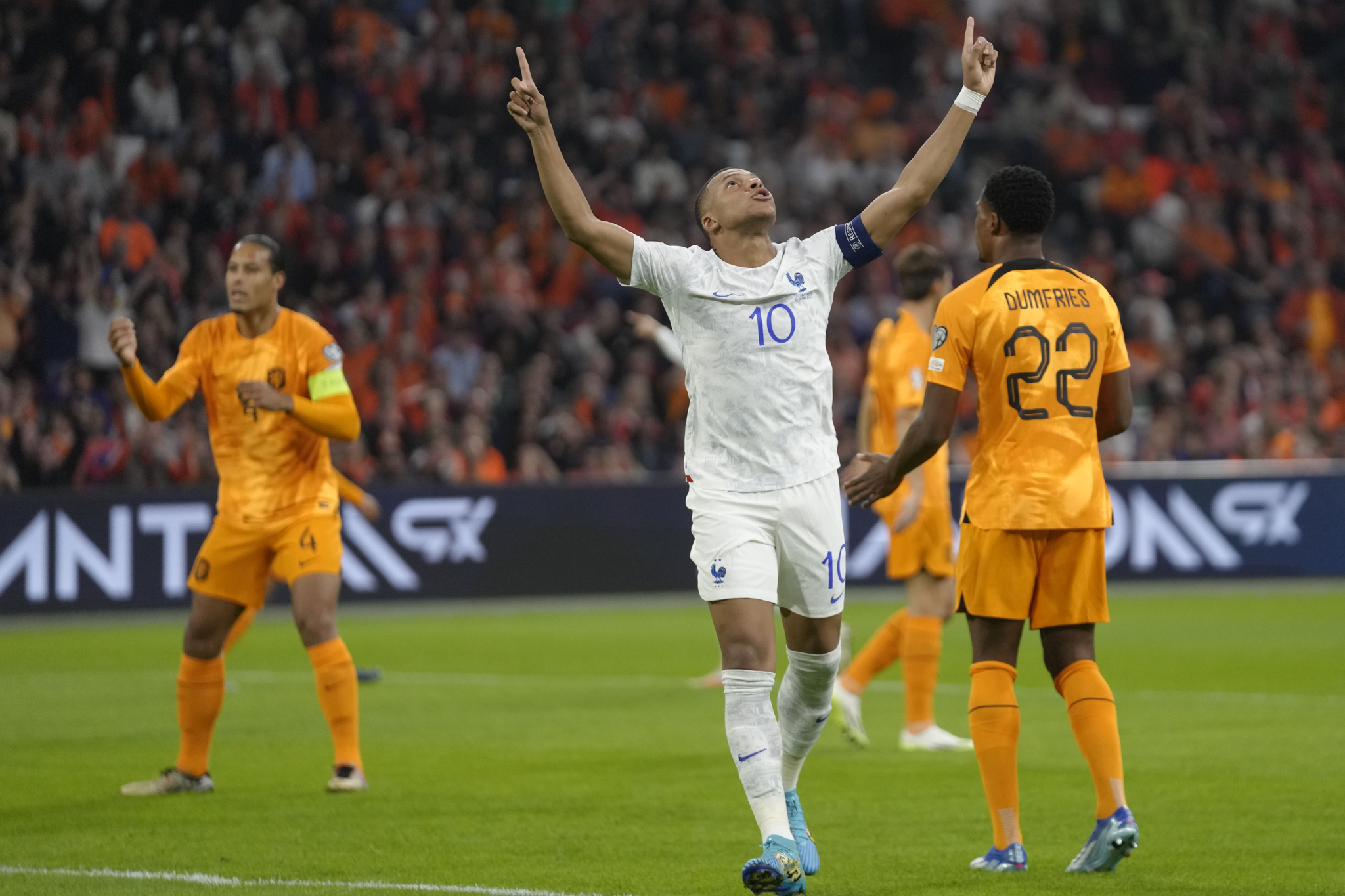 France's Kylian Mbappe, centre, celebrates after scoring