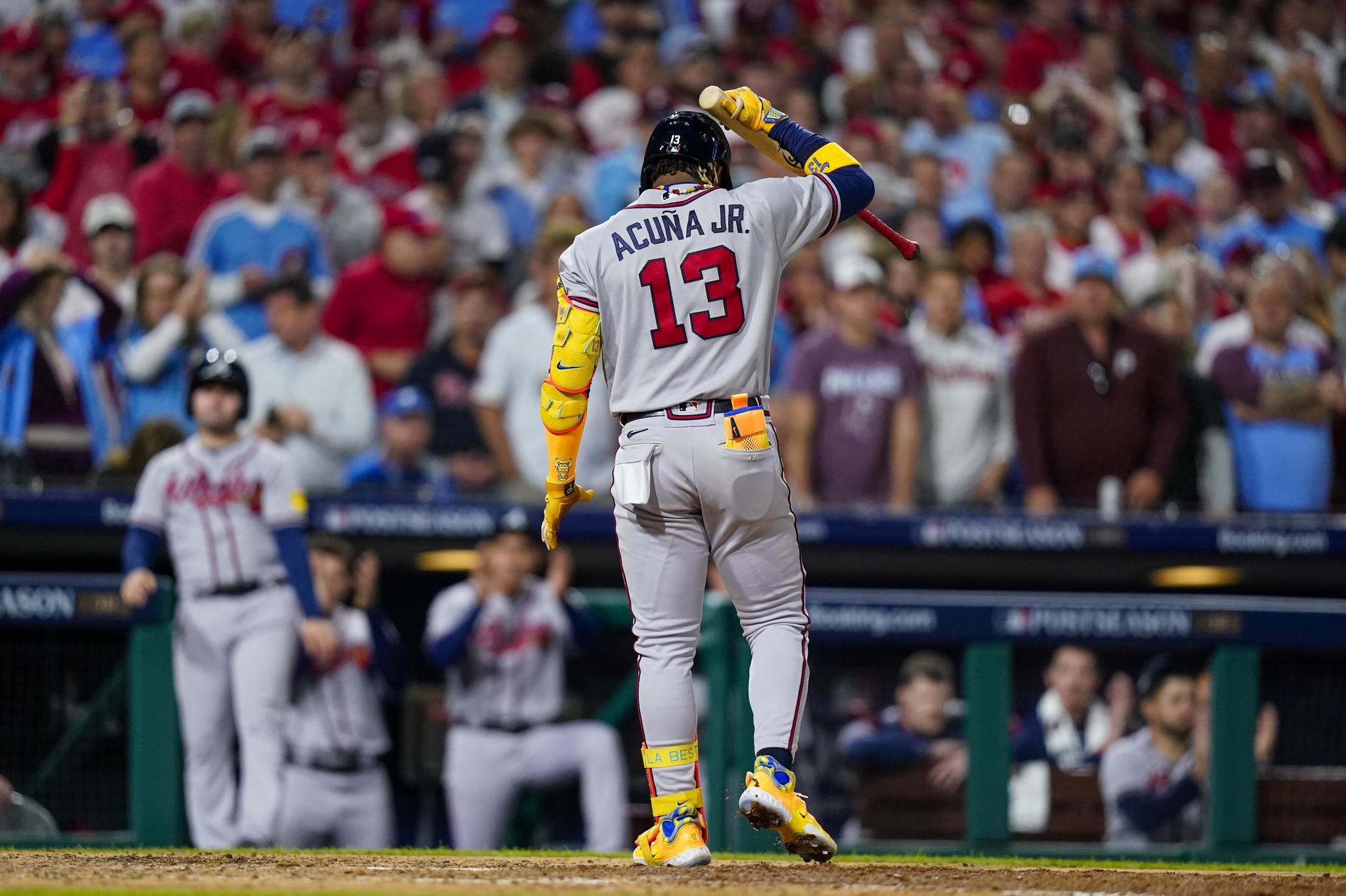 Atlanta Braves Ronald Acuna Jr. reacts after flying out with bases loaded during the seventh inning of Game 4 of a baseball NL Division Series against the Philadelphia Phillies Thursday, Oct. 12, 2023, in Philadelphia. (AP Photo/Chris Szagola)