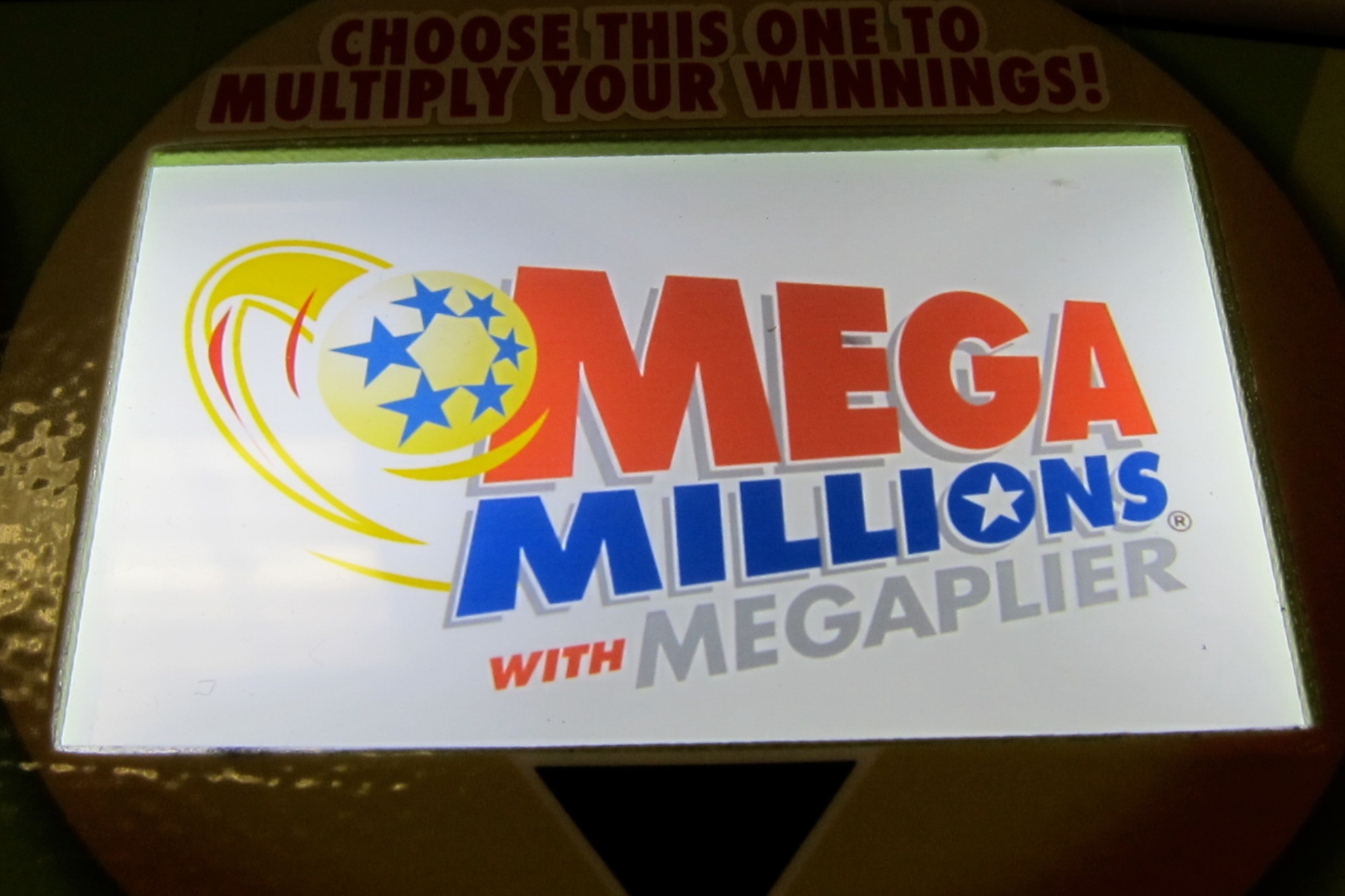 Mega Millions logo is seen on a lottery machine.