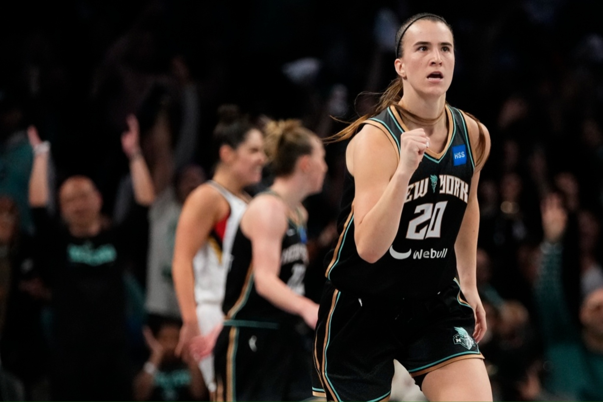 Ionescu celebrates after sinking a three-pointer at Game 4.