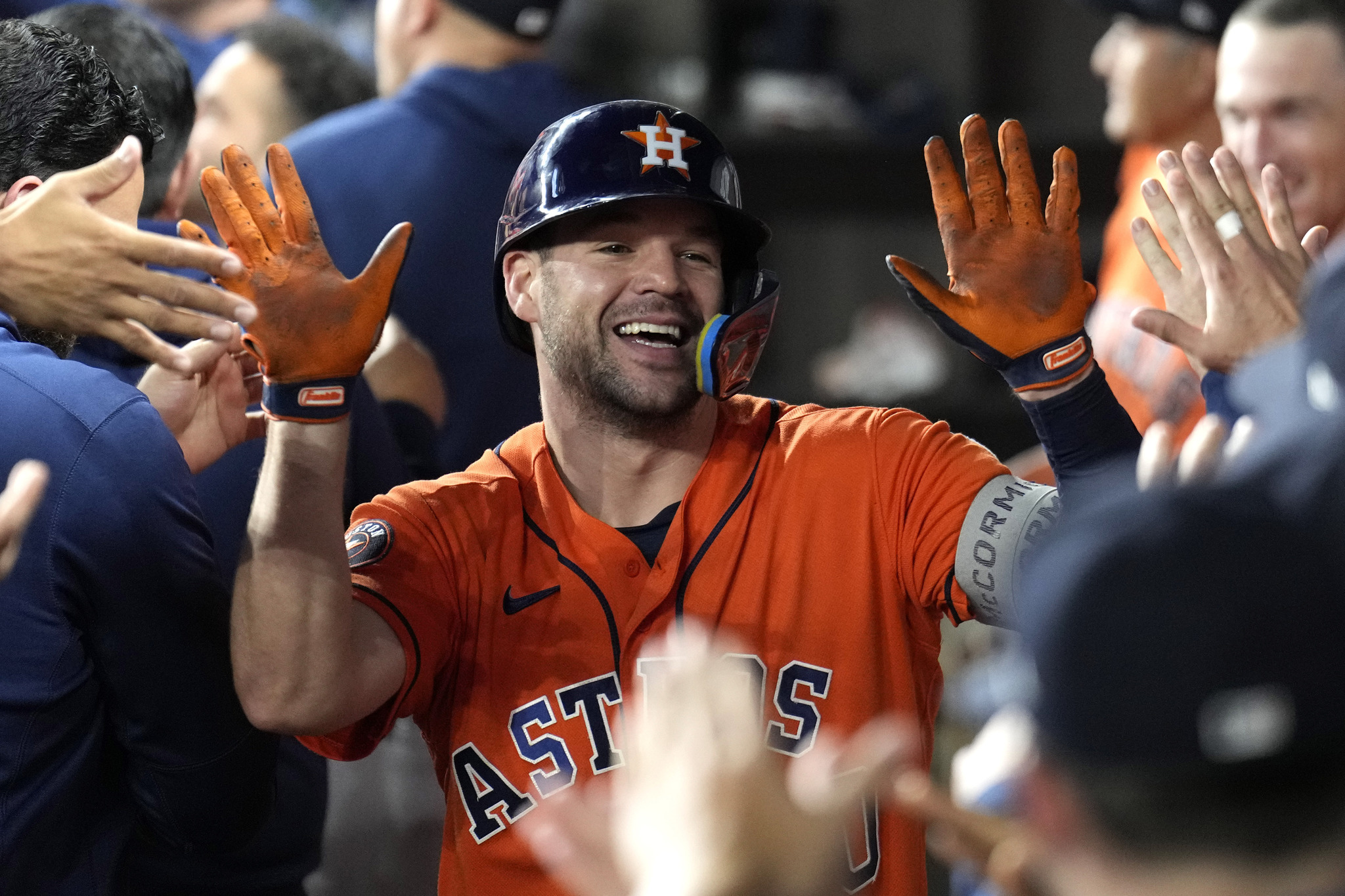 Houston Astros Chas McCormick (20) celebrates in the dugout after hitting a two-run home run against the Texas Rangers.