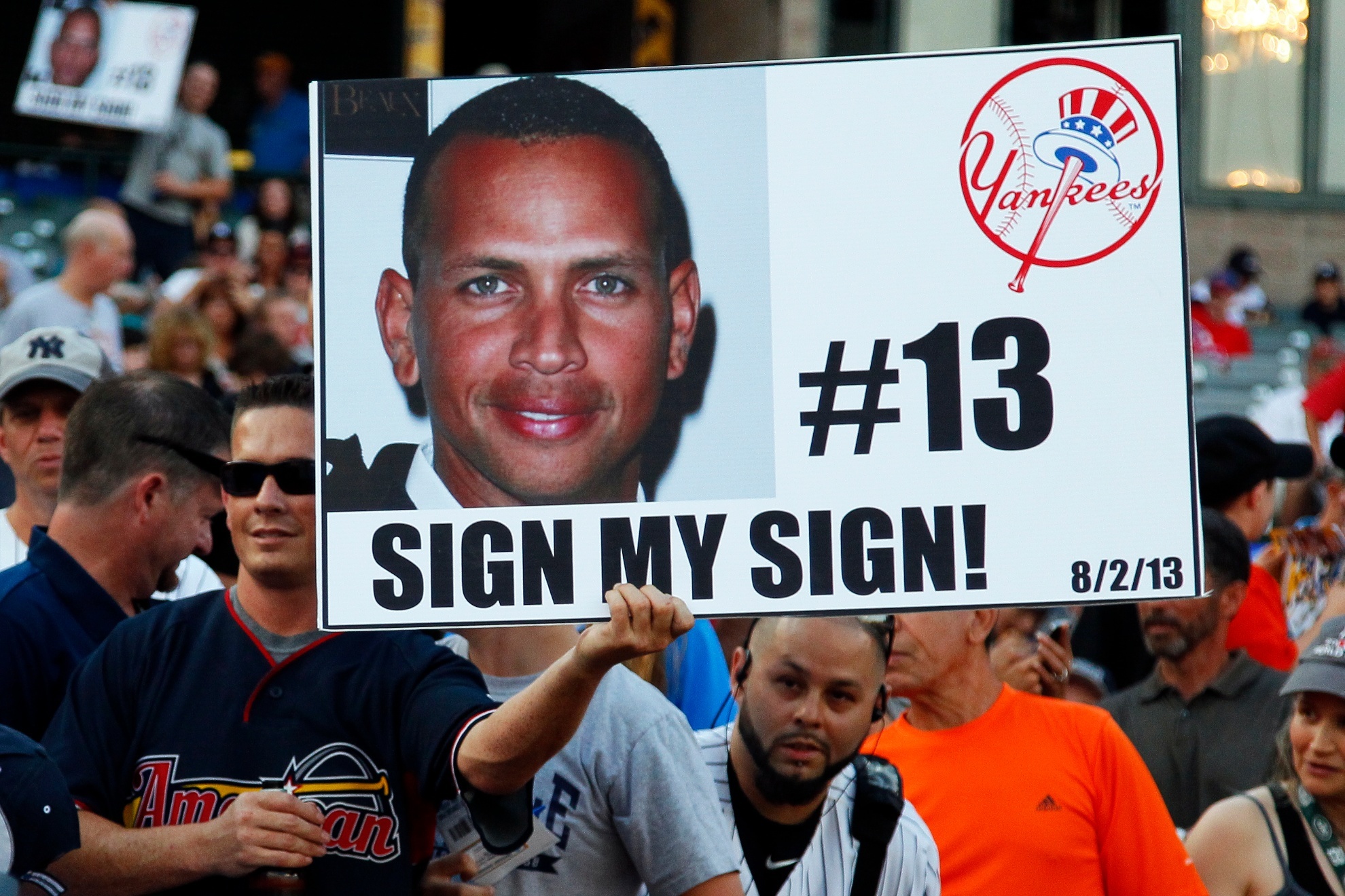 Yankees fan holds a sign of Alex Rodriguez