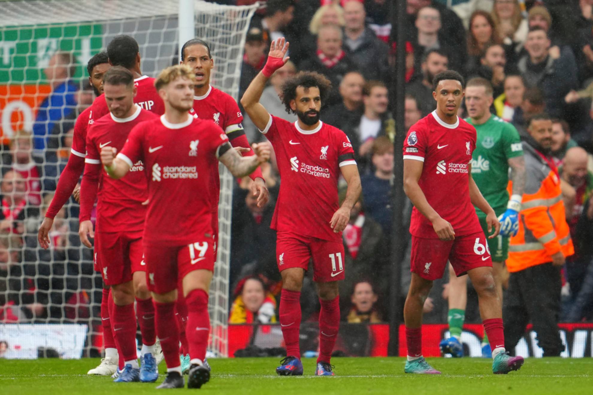 Liverpool players celebrate after Liverpool's Mohamed Salah, centre, scored his side's second goal
