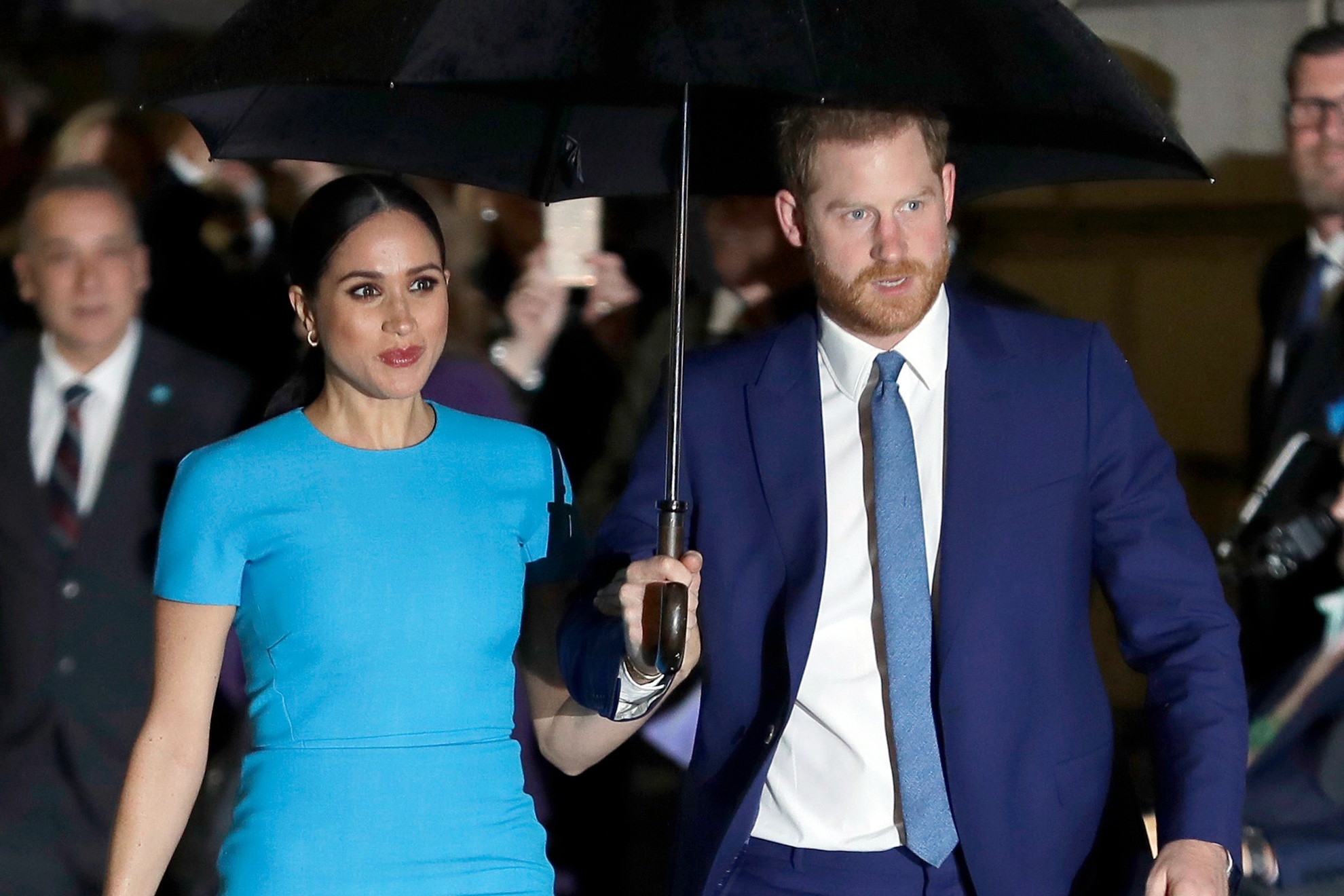 Prince Harry (right) with his wife, Meghan Markle.