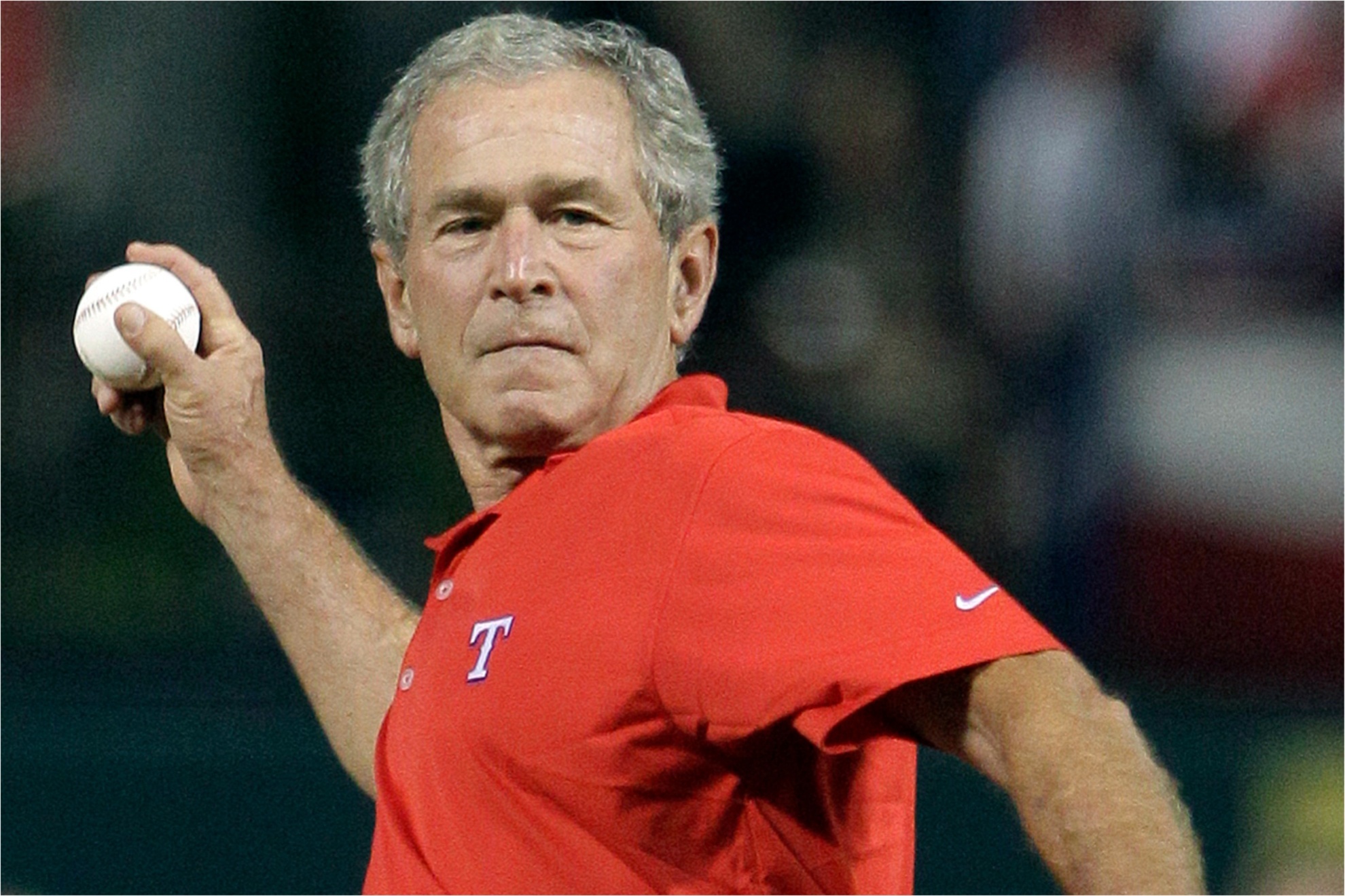Former President George W. Bush throws out the ceremonial first pitch before Game 4 of 2011 World Series.
