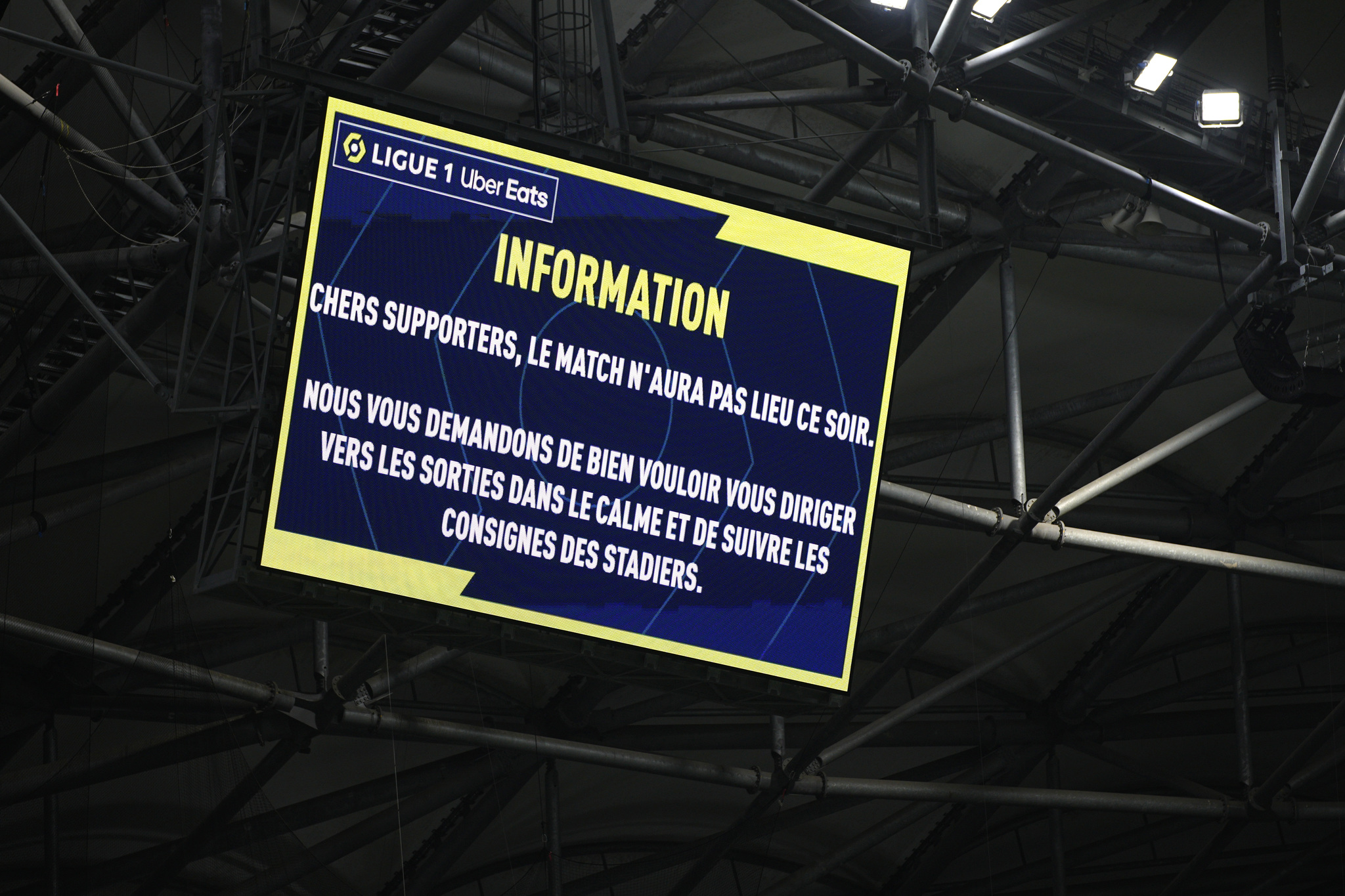 The screen with information that the French League One soccer match between Olympique de Marseille and Lyon is cancelled