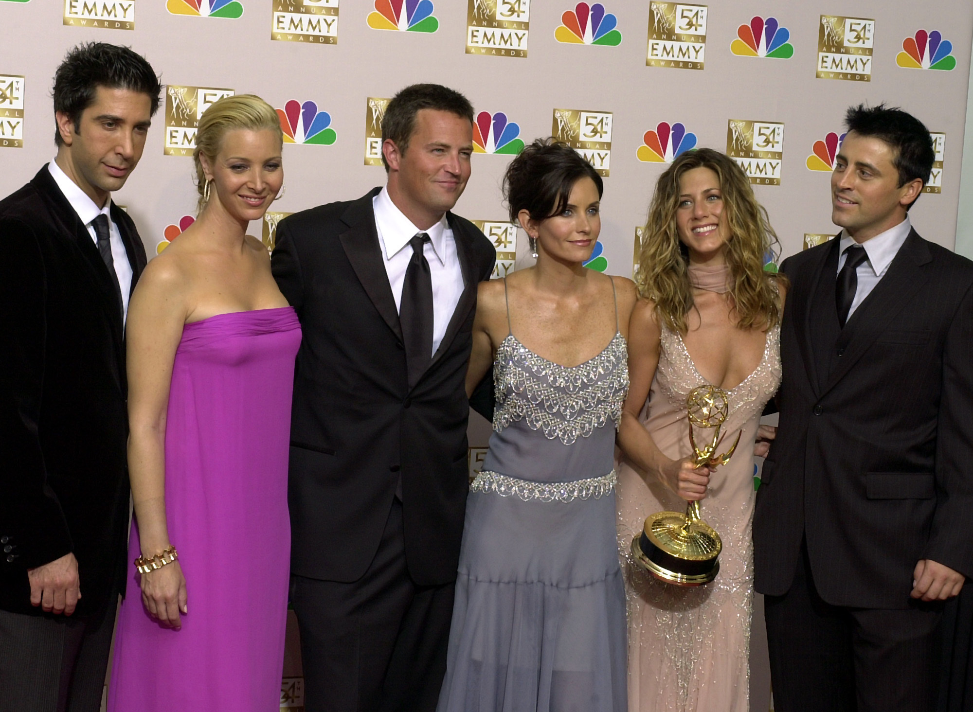 FILE - The stars of "Friends," from left, David Schwimmer, Lisa Kudrow, Matthew Perry, Courtney Cox, Jennifer Aniston and Matt LeBlanc pose after the show won outstanding comedy series at the 54th Annual Primetime Emmy Awards on Sept. 22, 2002, Los Angeles.