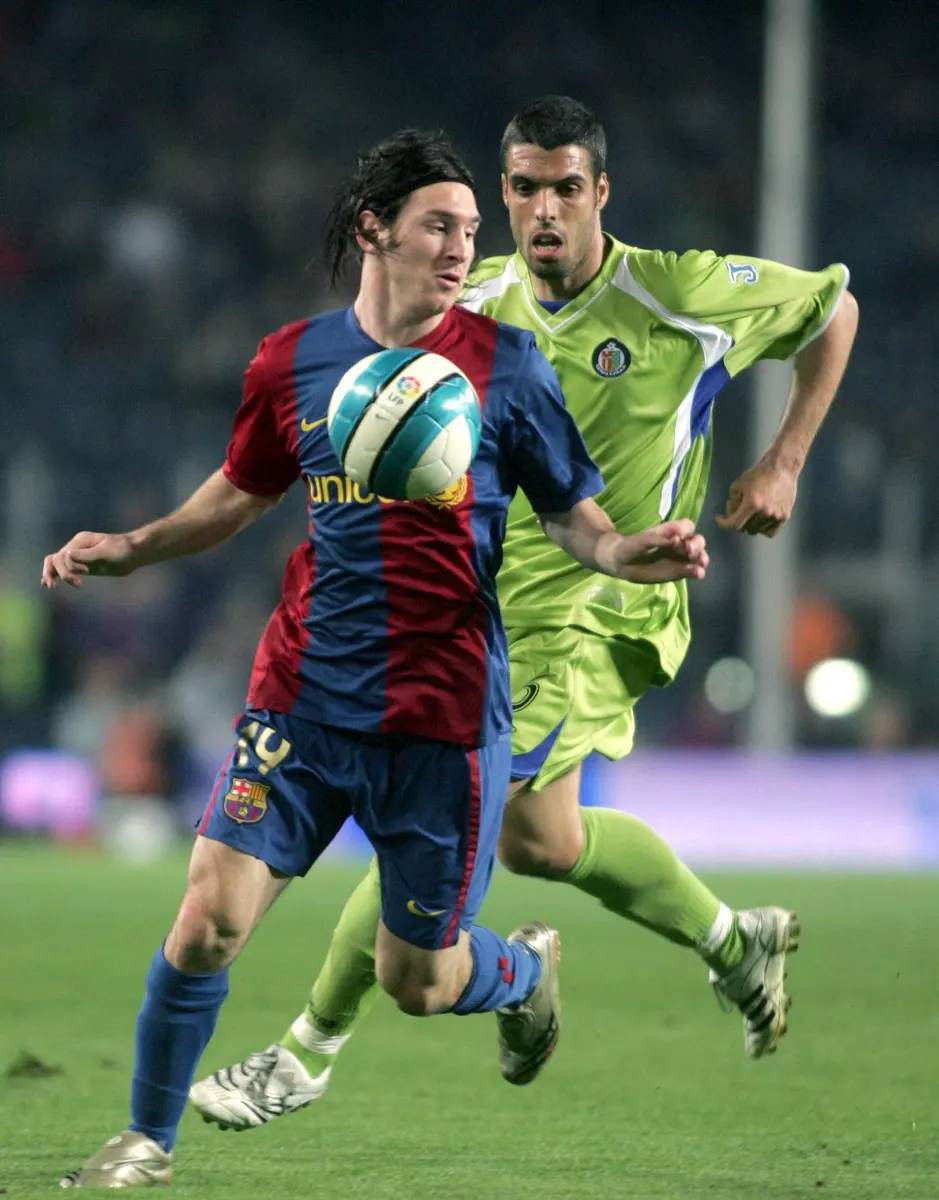 Leo Messi y Fabio Celestini en el Camp Nou