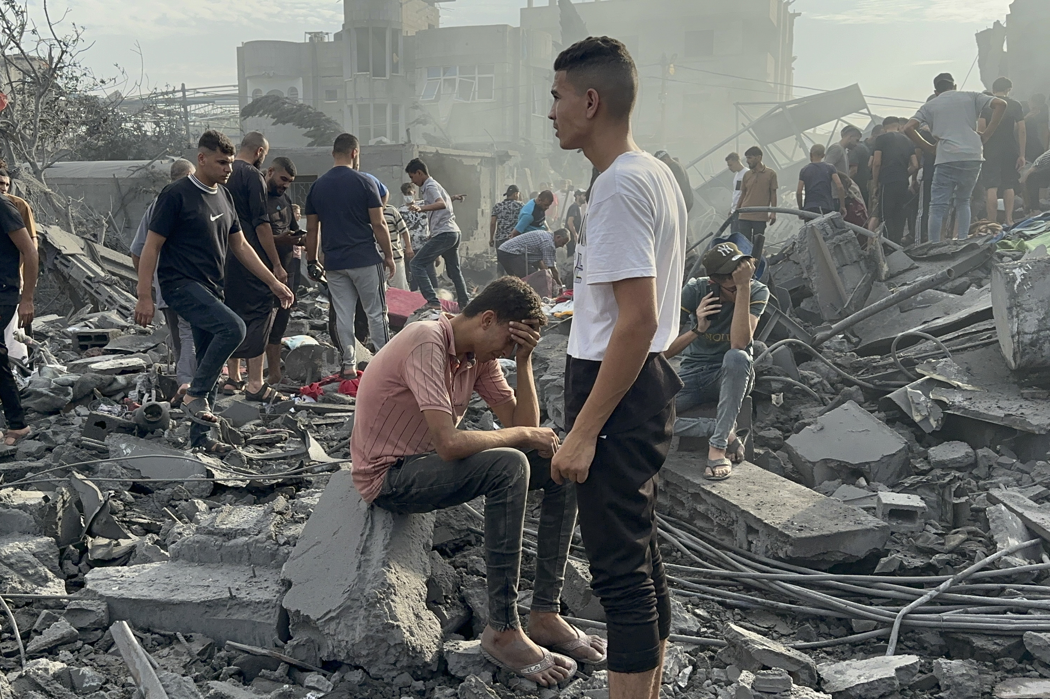 Palestinians look for survivors following Israeli airstrike in Nusseirat refugee camp, Gaza Strip.