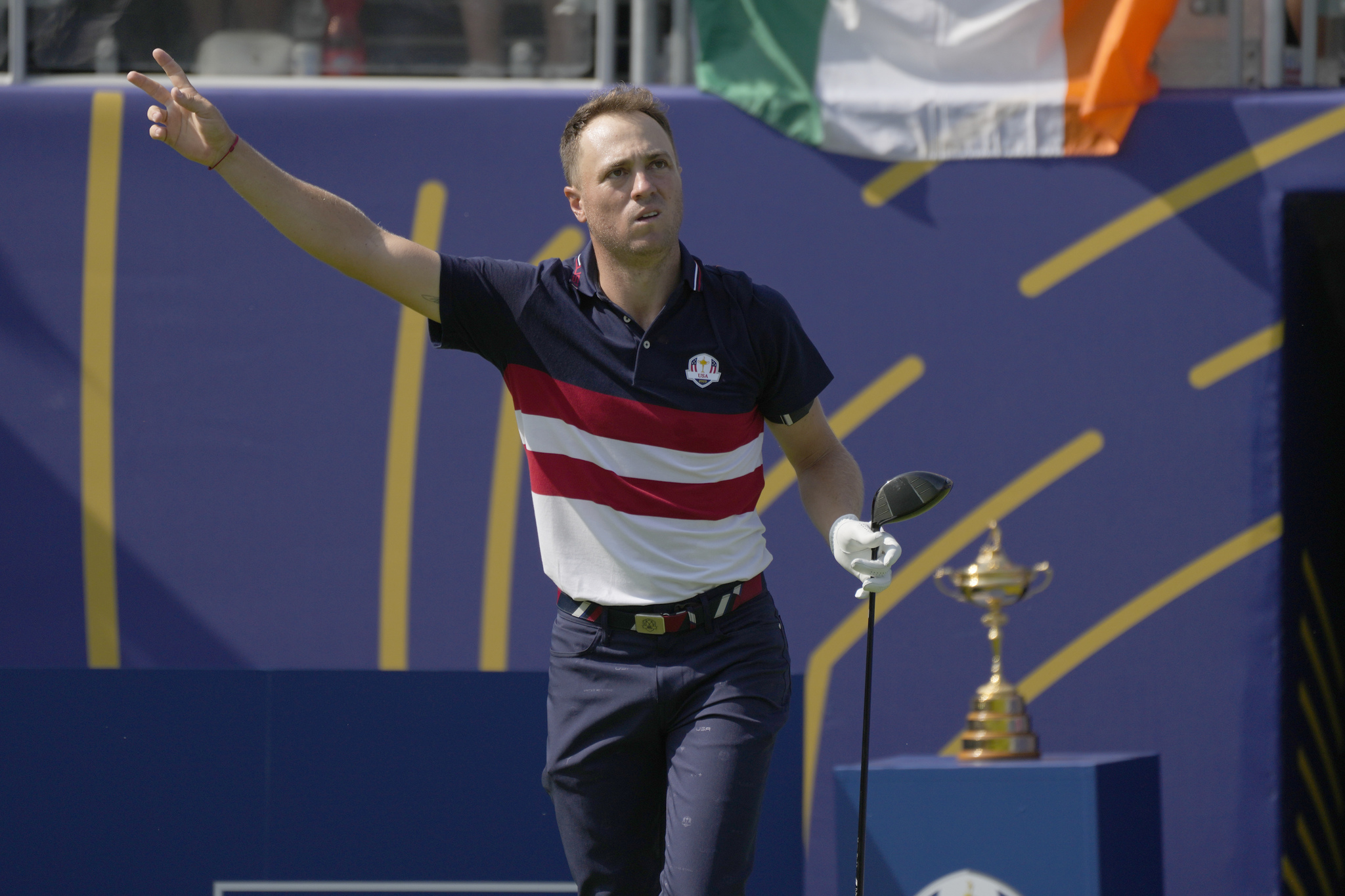 Justin Thomas reacts on the first tee as his ball goes right off the tee during his singles match at the Ryder Cup golf tournament.